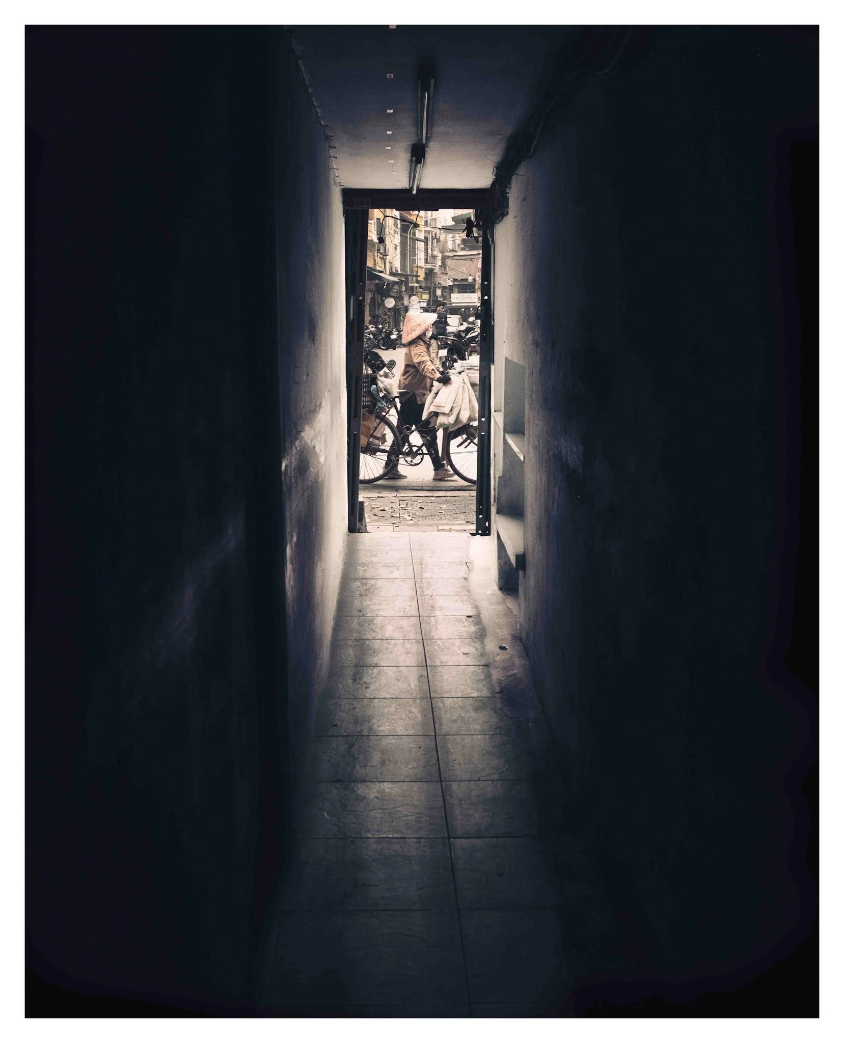 Hanoi from the shadows. #HanoiRoads

📷 @fujifilmx_us
🎨 @Lightroom
📸 Fuji 23mm 1.4
&copy; Wes Marsala 2025

#Hanoi #HoanKiemLake #VietnamTravel #StreetPhotography #DarkAlley #CinematicVibes #UrbanContrast #VietnameseCulture #CityLife #MoodyTones
