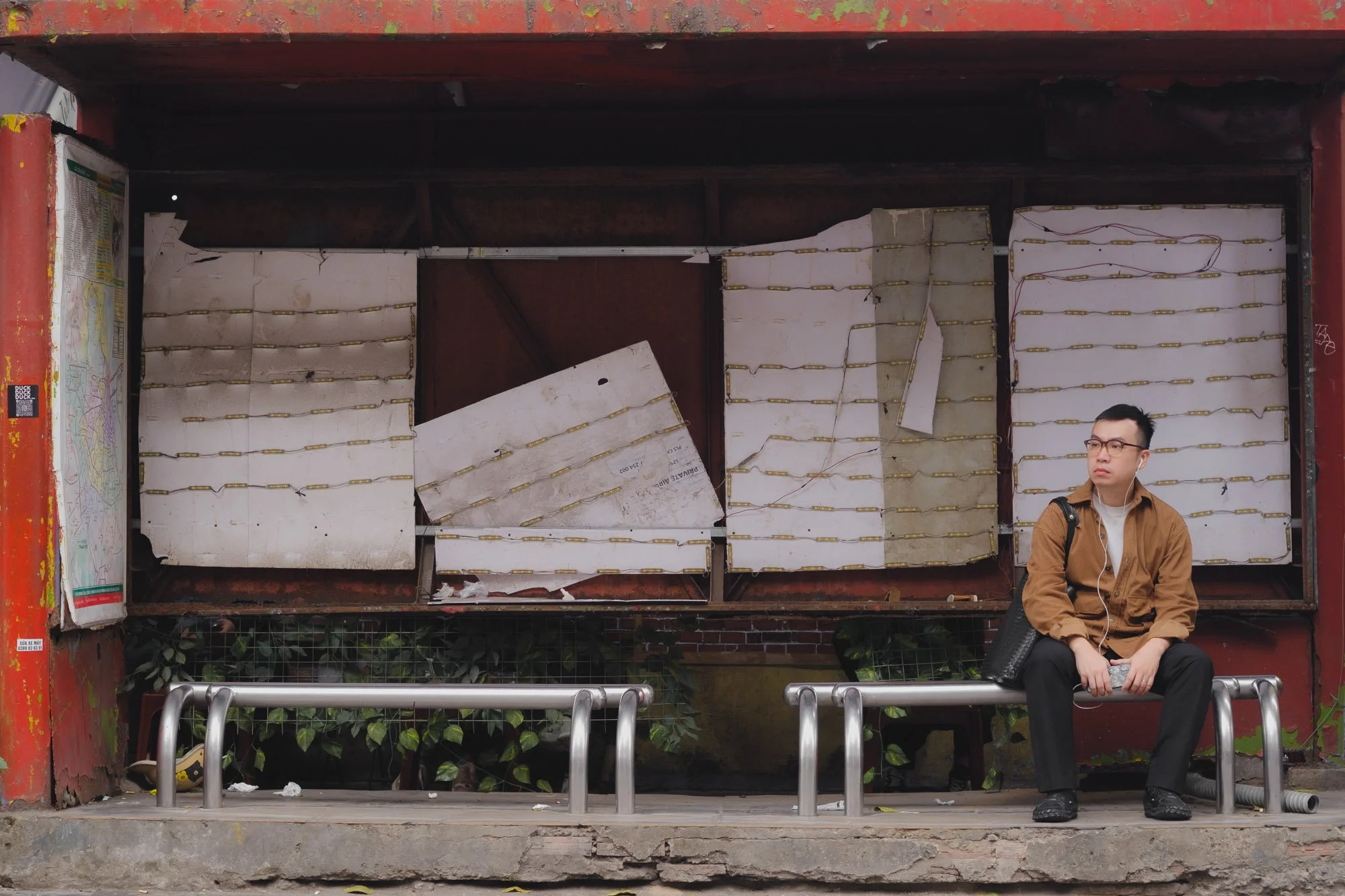 Waiting at the bus stop in Hanoi, Vietnam.