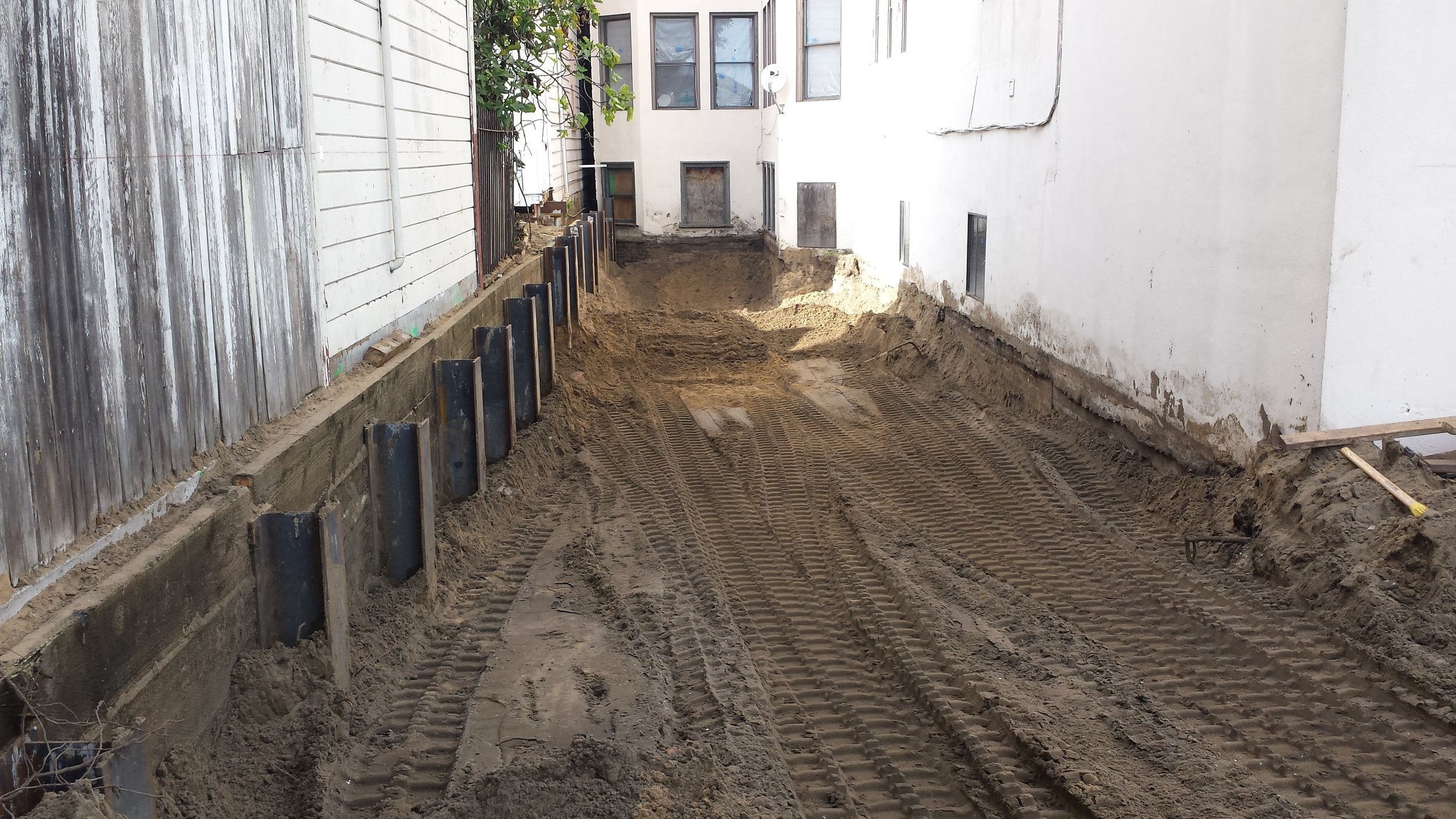 Rectory exterior excavation and retaining wall.