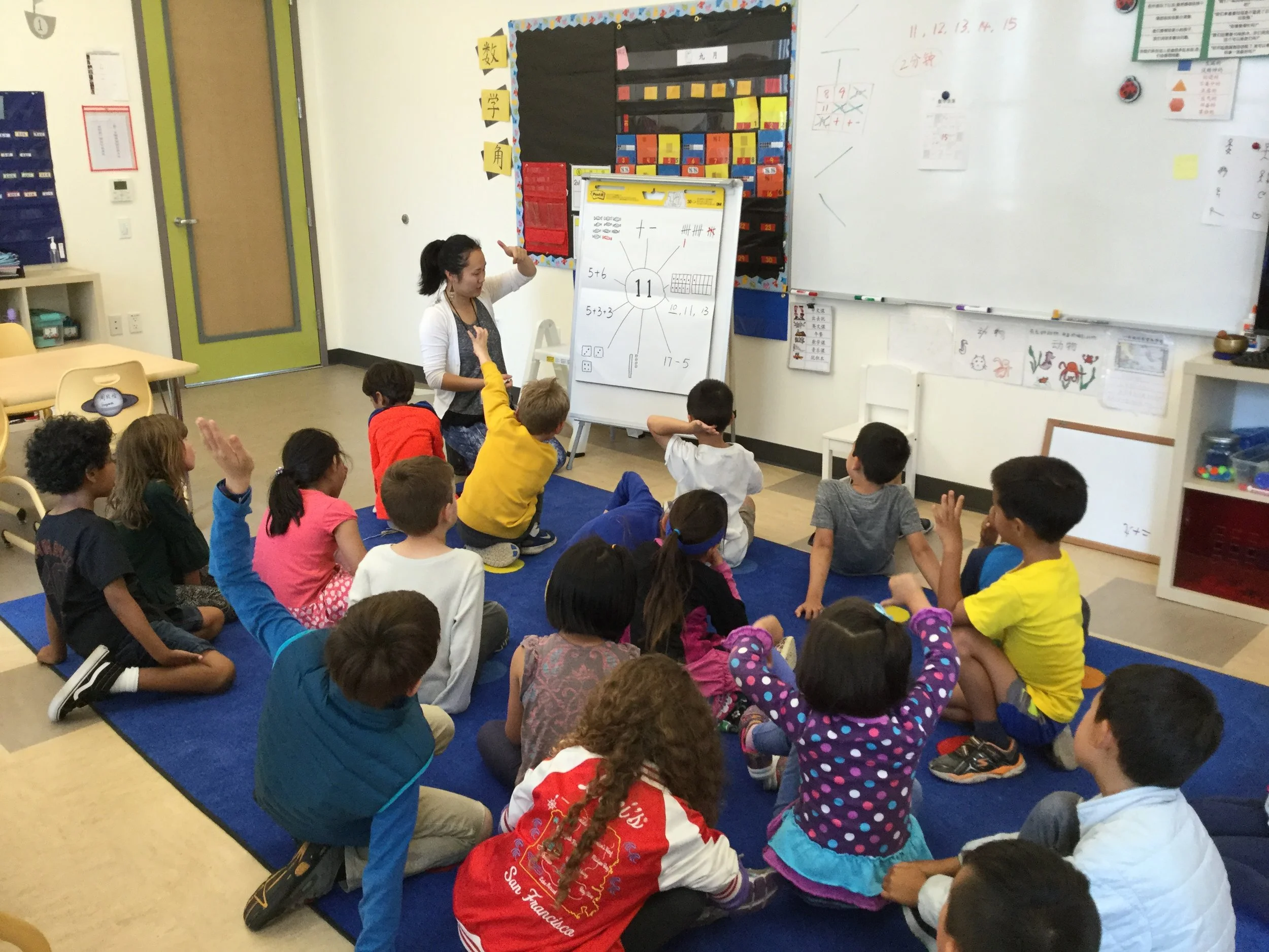 Busy first graders enjoying class activity .