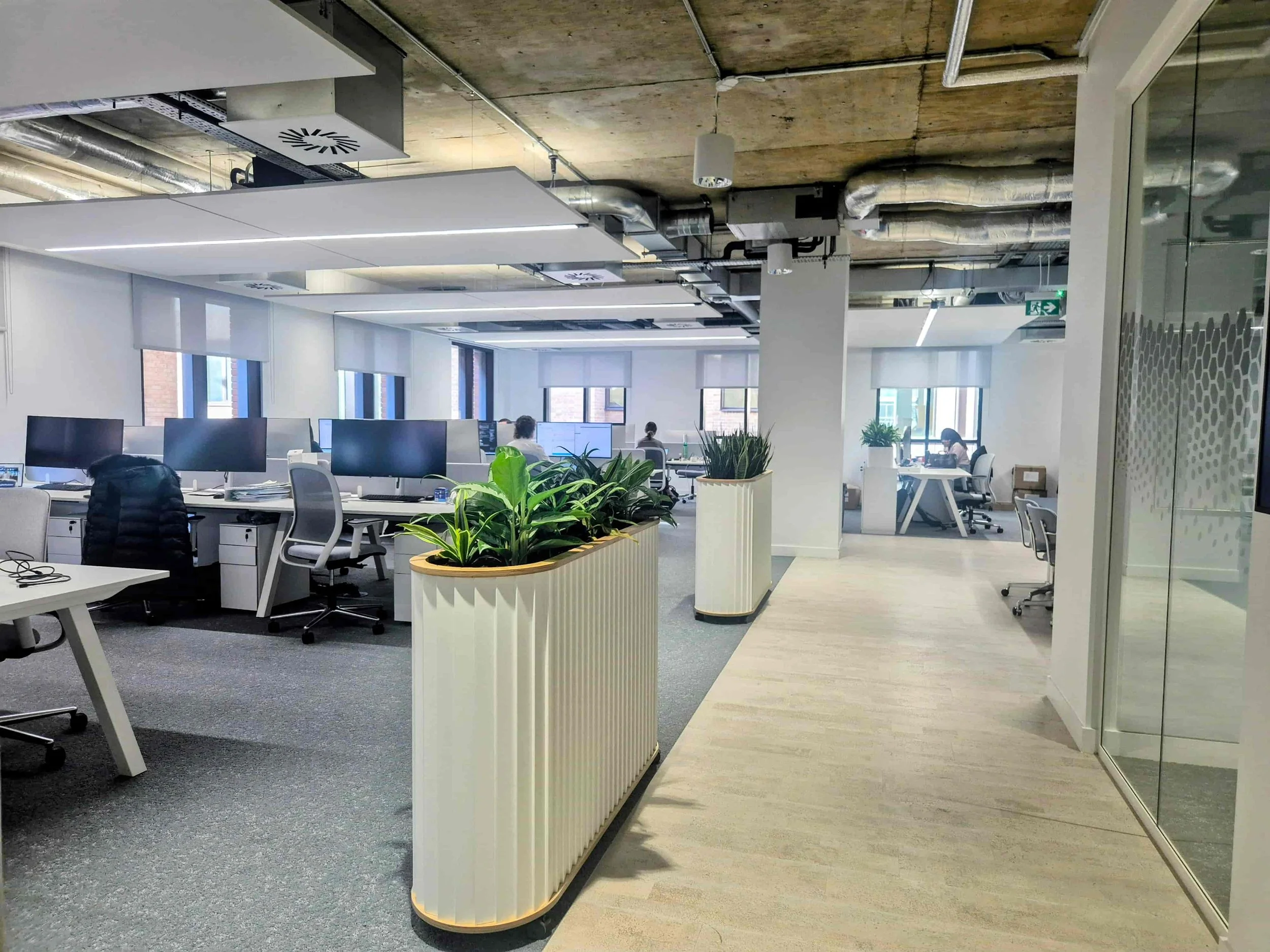 High-end office planting scheme with joinery planters London