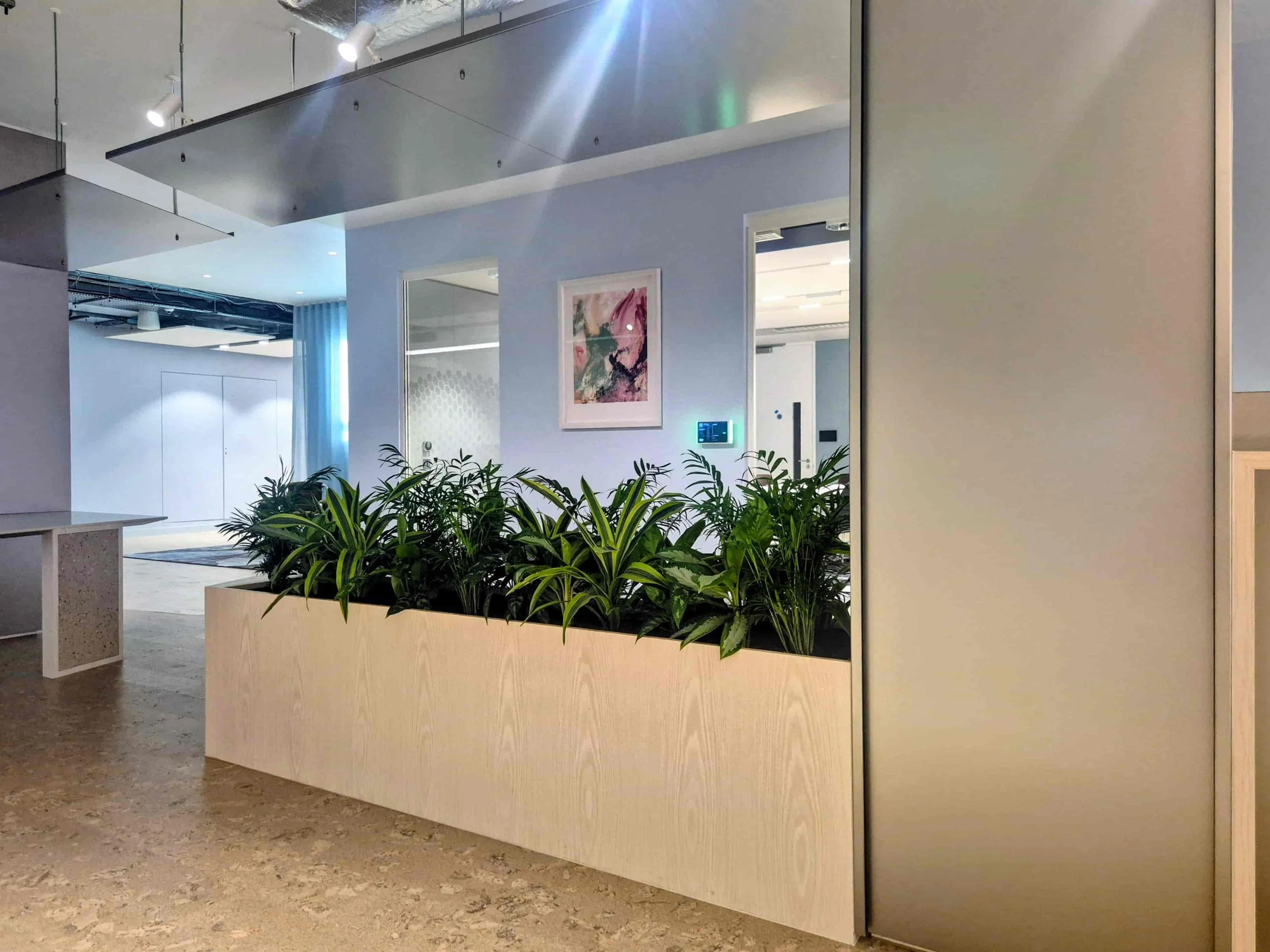 Bespoke joinery planting integrated into office design London