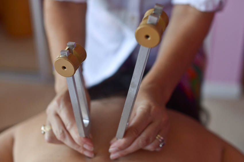 TUNING FORKS A tuning fork is a two-pronged fork-like instrument that emits a sound and vibration. As the fork vibrates, the air around it also vibrates and the vibration and sound have a healing effect on the body. By striking the appropriate tuning fork and placing it on specific acupuncture points the vibration can help restore balance to that area and allow healing to occur.