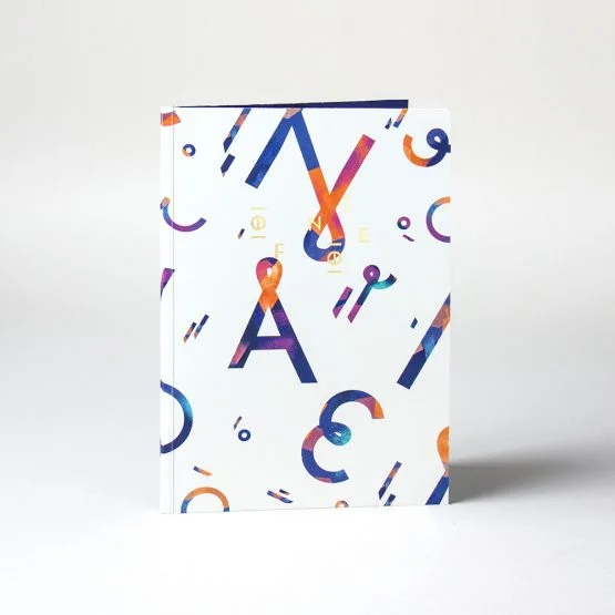 214B10-OF-NOTE-Notebook-Happy-letters-Front-555x555.jpg