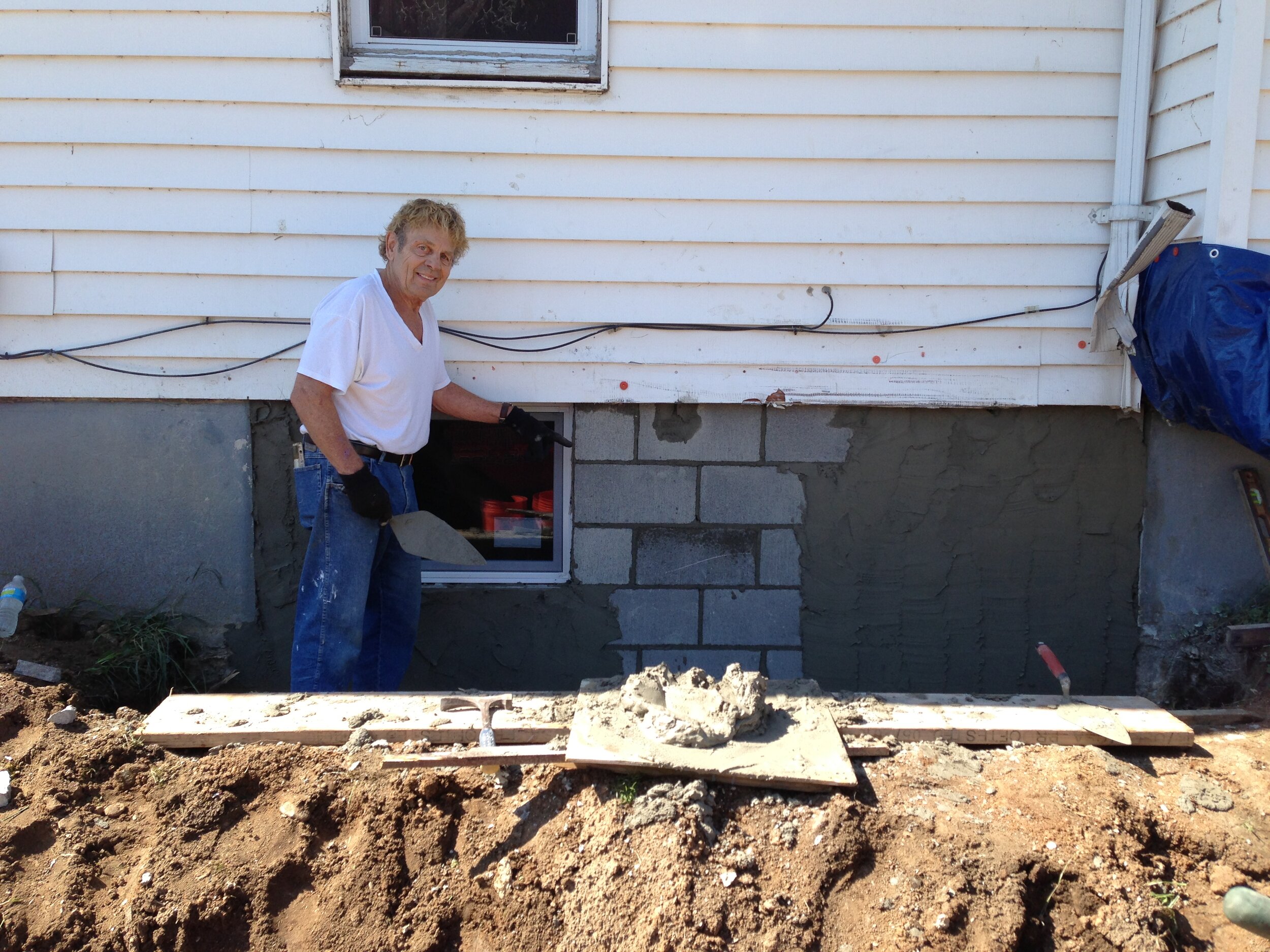 Bernie Klaene applying stucco