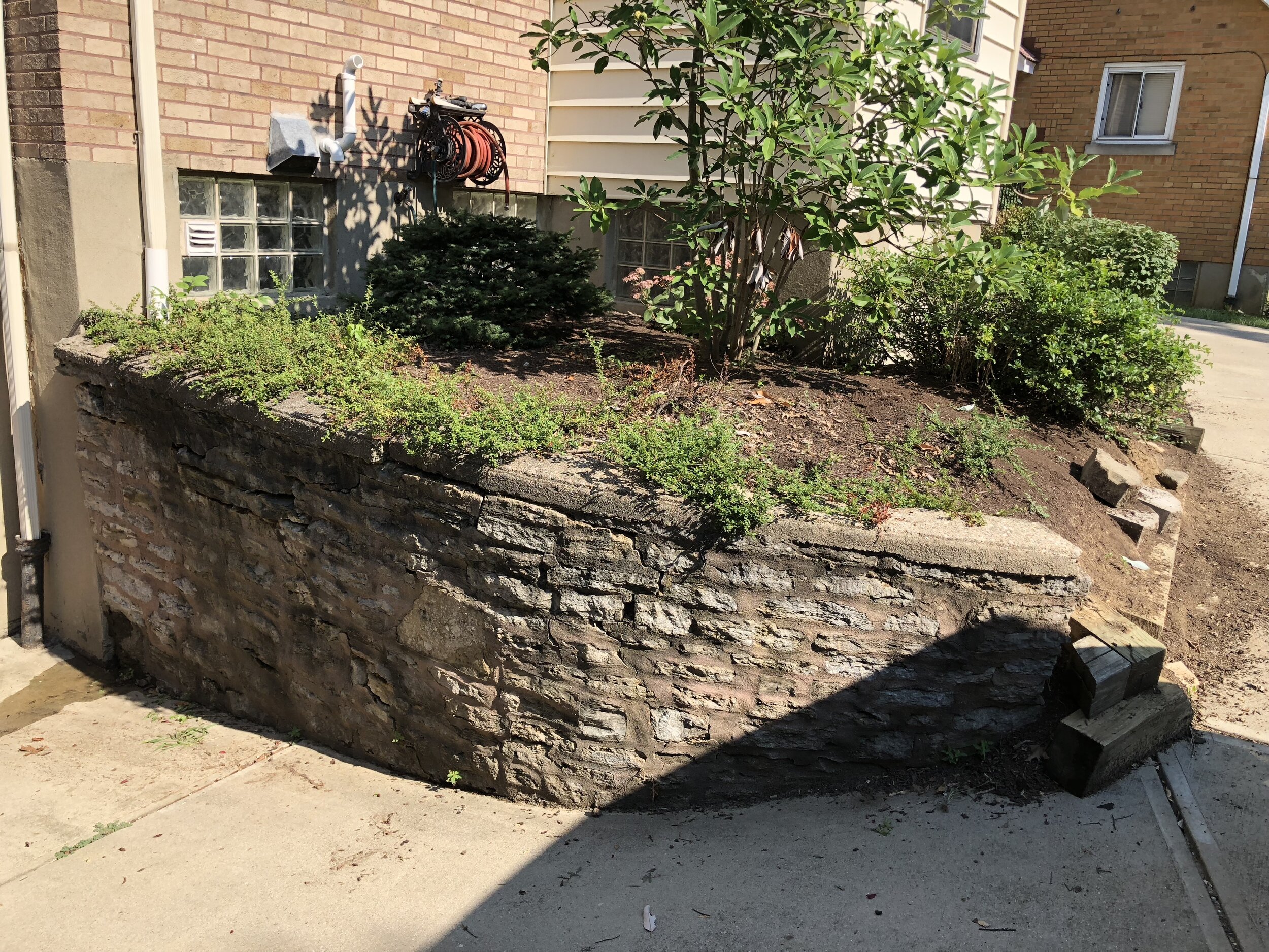 Stone wall rebuild and redesign photo 1