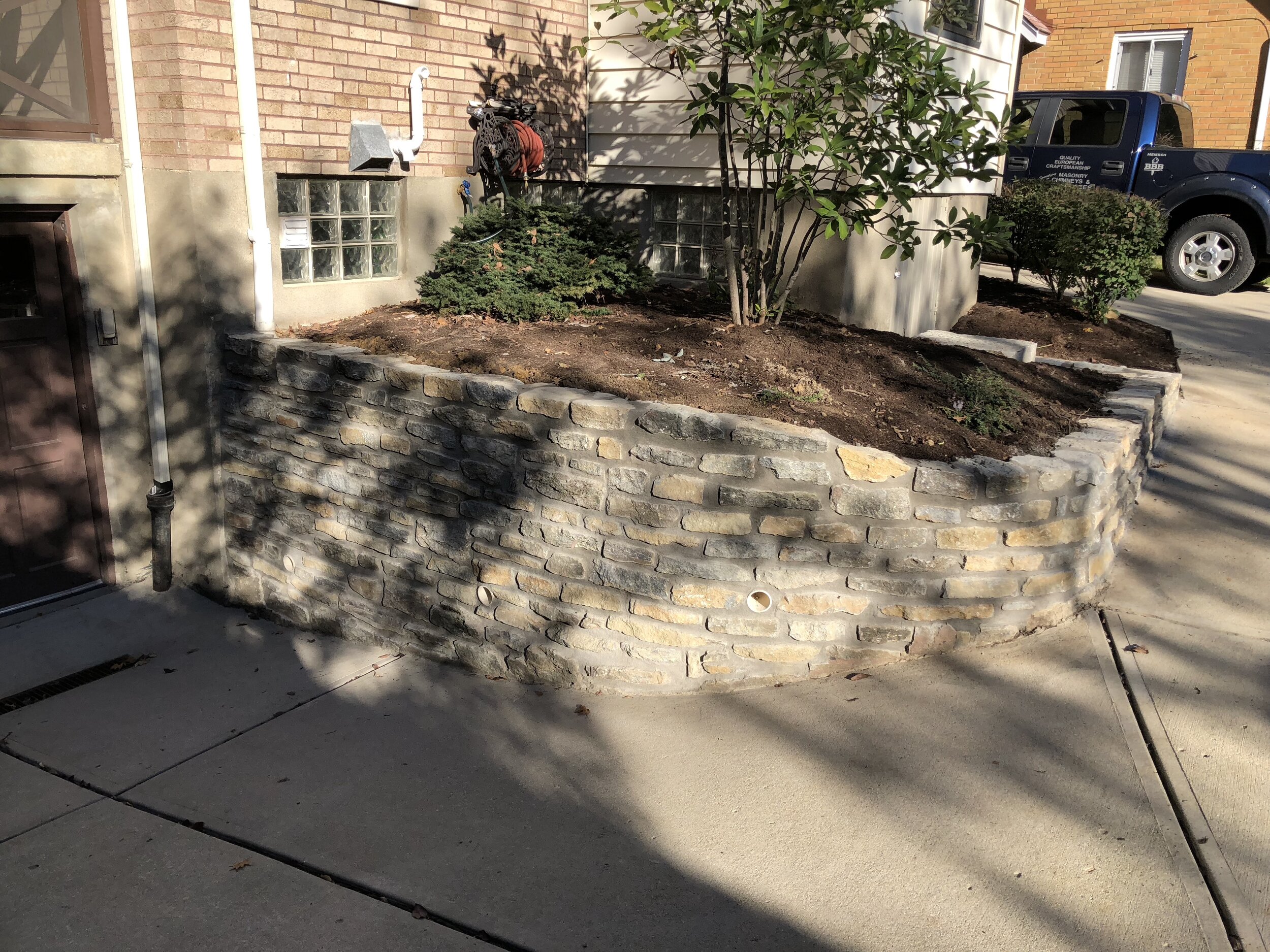 Stone wall rebuild and redesign photo 6