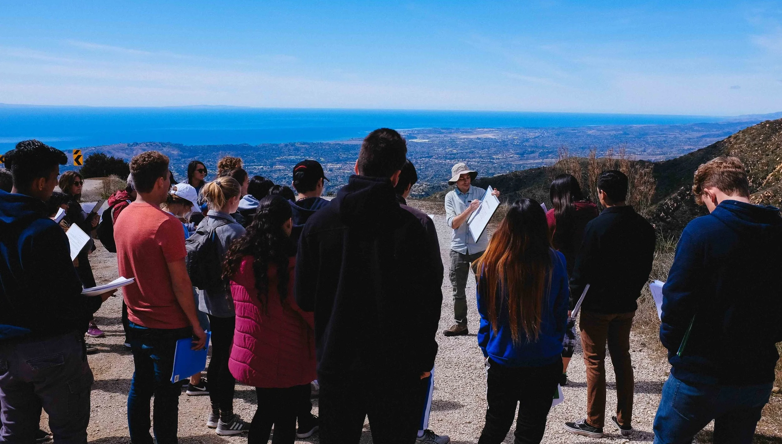 Leading a UCSB undergraduate field trip in the Santa Ynez mountains. Immediately behind me, you can just about make out the UCSB campus nestled against the coast.