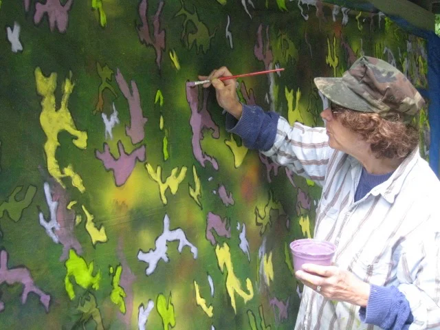 …The slightness and gentle gesture of hanging this shimmery fabric in the trees, catching the streaming sunlight, is offset by the association of camouflage; hunting and ongoing warfare. These thoughts feel somehow out of place in this pastoral setting, but are all the more striking for this reason. – Philipstown.Info, Amy Lipton, Director, ecoartspace, NYC and independent Curator