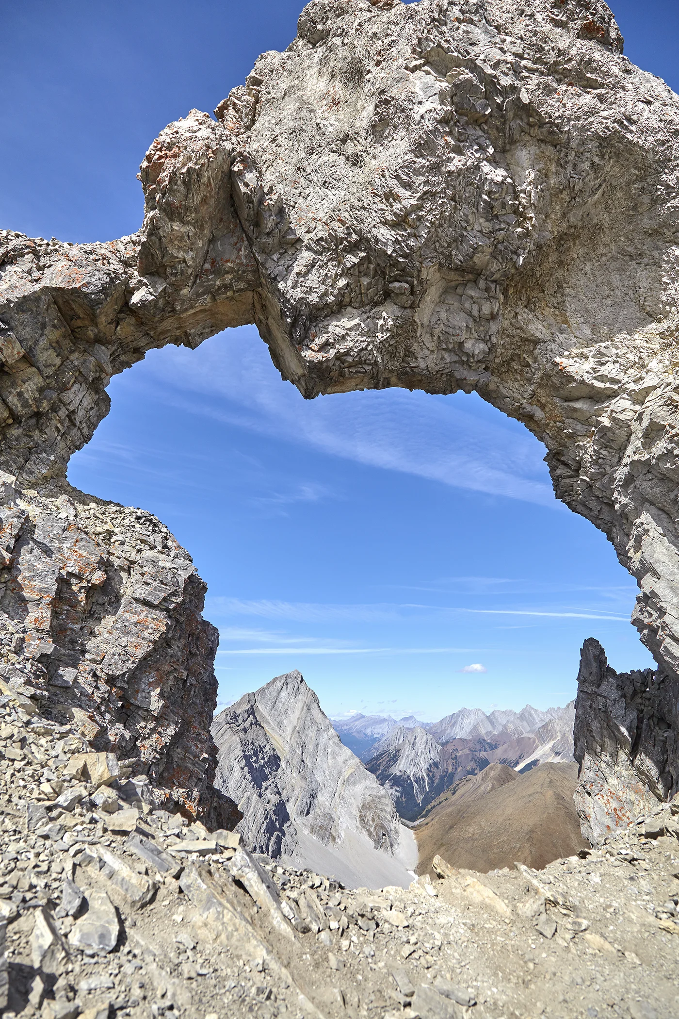 Mount Pocaterra, as seen through Mount Tyrwhitt’s rock arch.