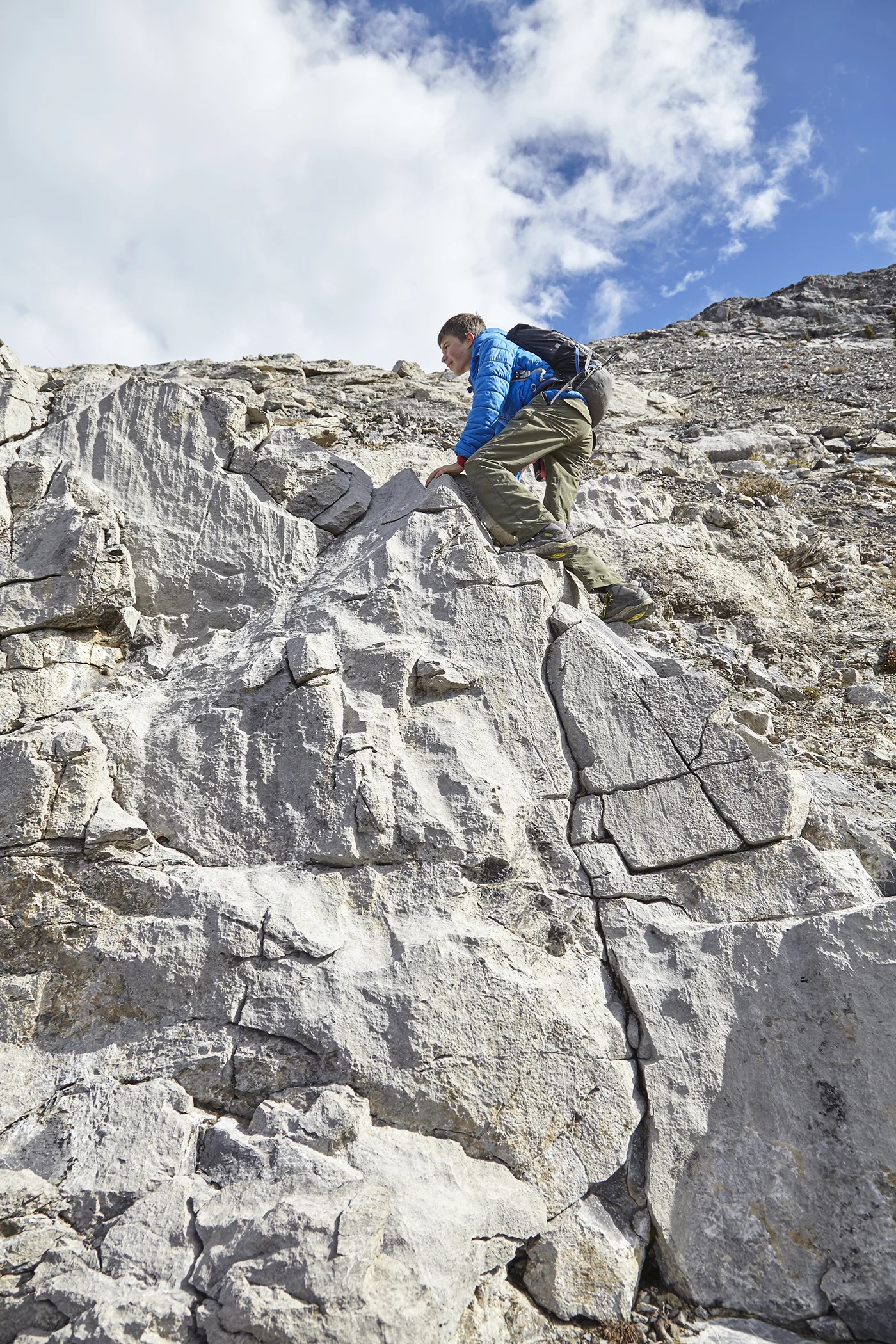 Yuri does some optional scrambling near the summit.