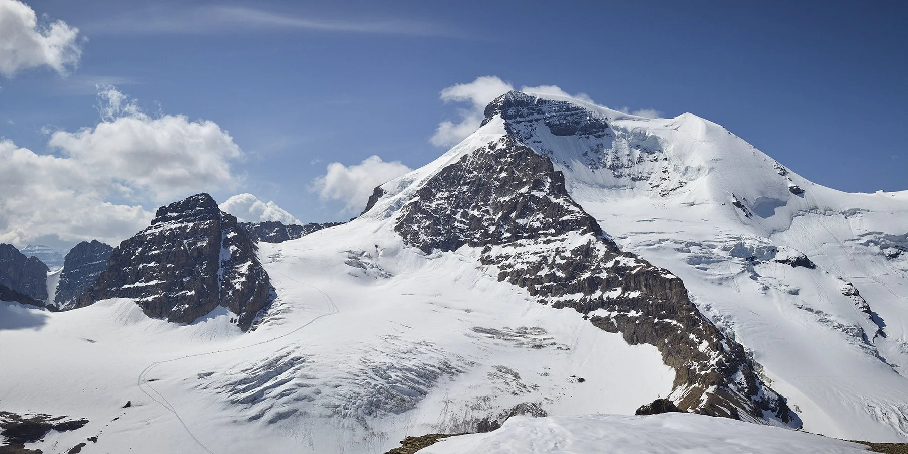  Mount Athabasca, Jasper National Park. This composite was captured from the summit of Boundary Peak during Peak Week 2023. On the surface it’s a scale image: small climbers against a massive face, tucked into a quiet corner of the Rockies. But it ha