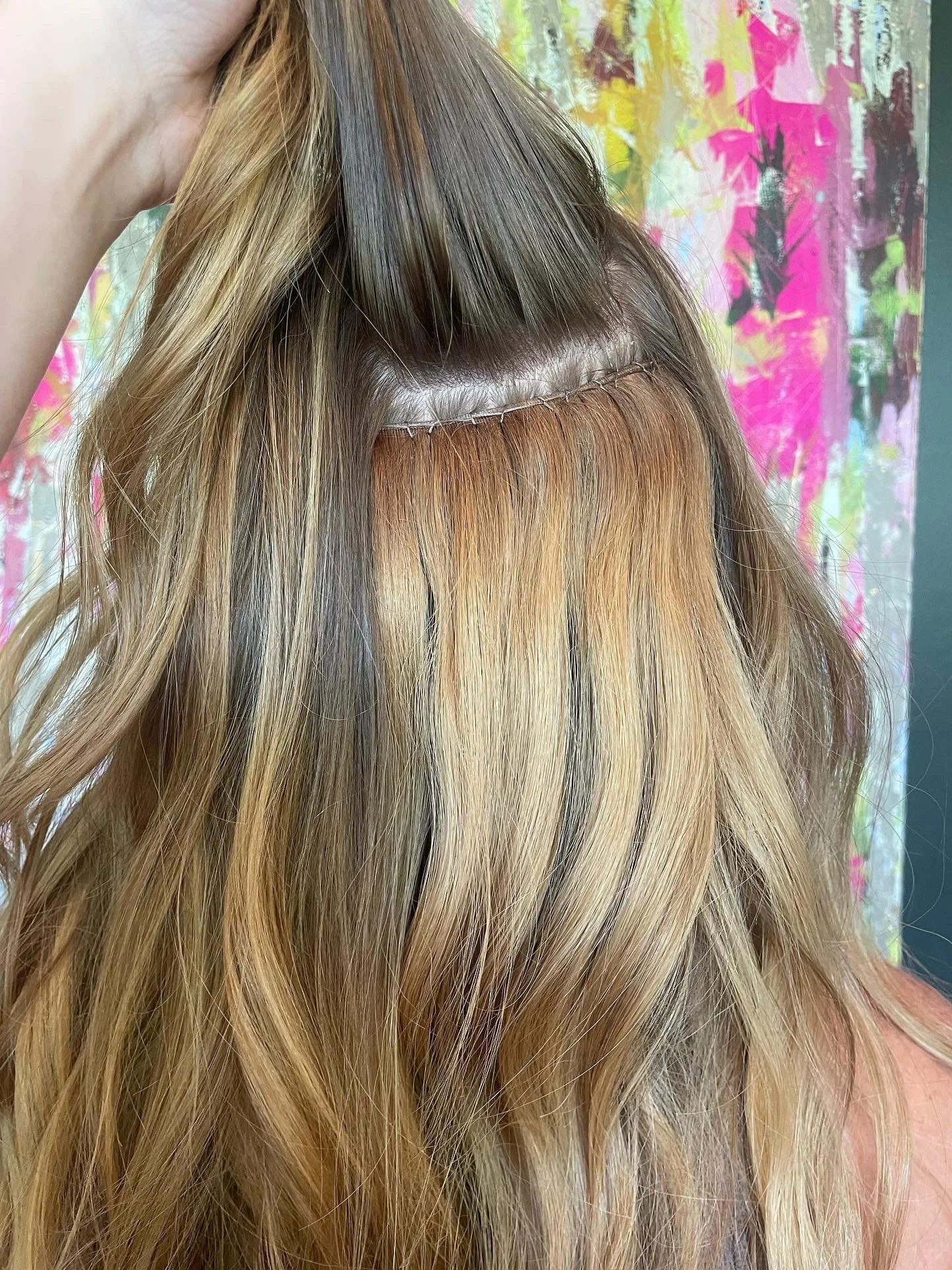 One row of 18 inch @harperellishairco extension installed by @styled.by.karson using the invisible beaded weft method.