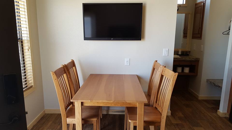 dining room table and tv view from the couch.jpg