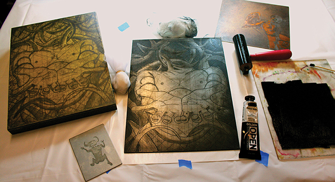 Inking copper and zinc plates with OPEN Acrylics requires a little practice to perfect the wiping technique. On the left side of the image the final print is mounted to a wood panel using Soft Gel and then several thin coats of “acrylic encaustic” were added.