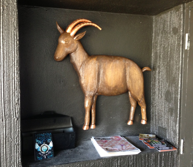 …and here is the goat installed at the front door to the restaurant, at home in his little niche guarding the mail and greeting customers.