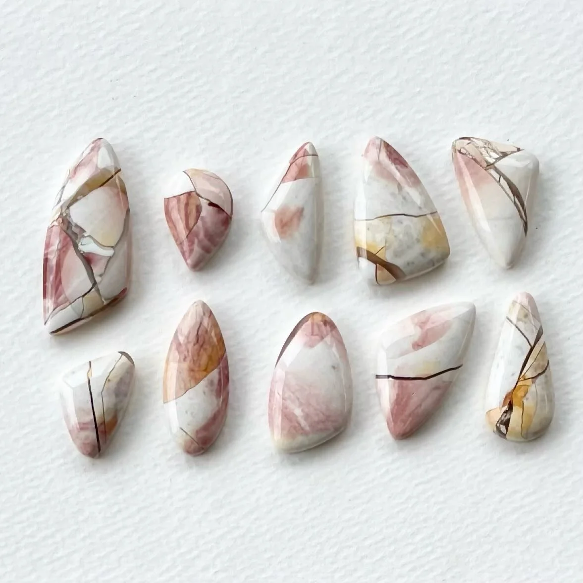 As the daughter of a geologist I grew up learning about all types of rocks -how they were formed what they are made of. As a jeweler I get to choose how I use them in an appropriate way for adornment. This collection of brecciated mookaite is so love