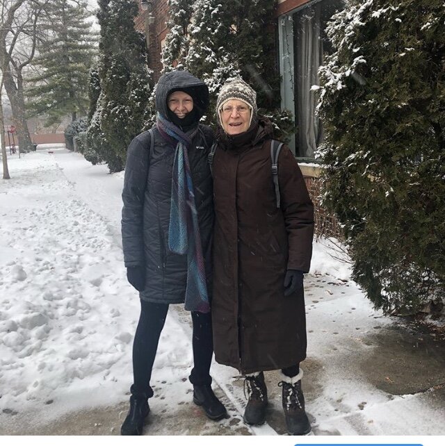 Diane and her friend, DP, enjoying time together walking outside in the snow and ice.