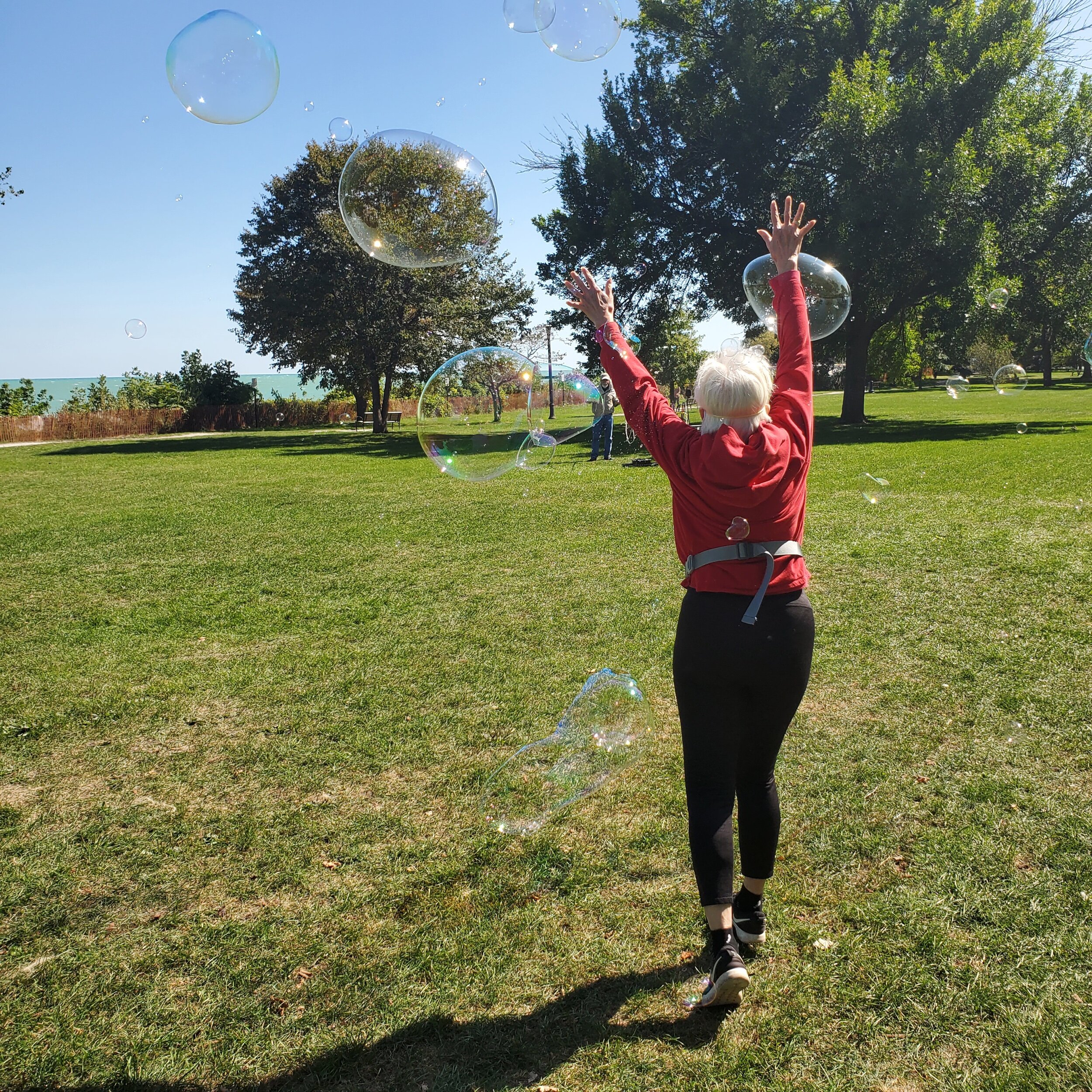 Diane enjoying. bubbles at the lakefront.