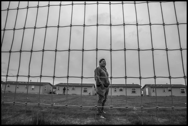Dorian Lopez, an H2A guest worker from Mexico, lives in barracks in central Washington. Photo by David Bacon