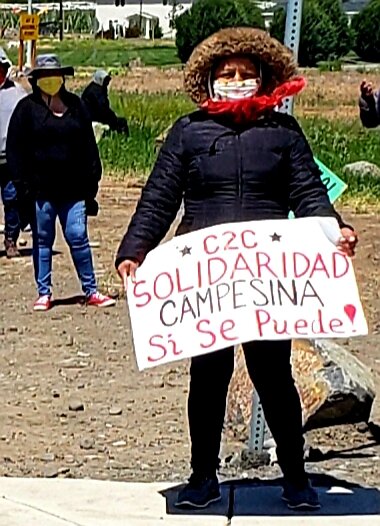  Woman holding down the strike line at Allan Bros.   Photo by Brenda Bentley  