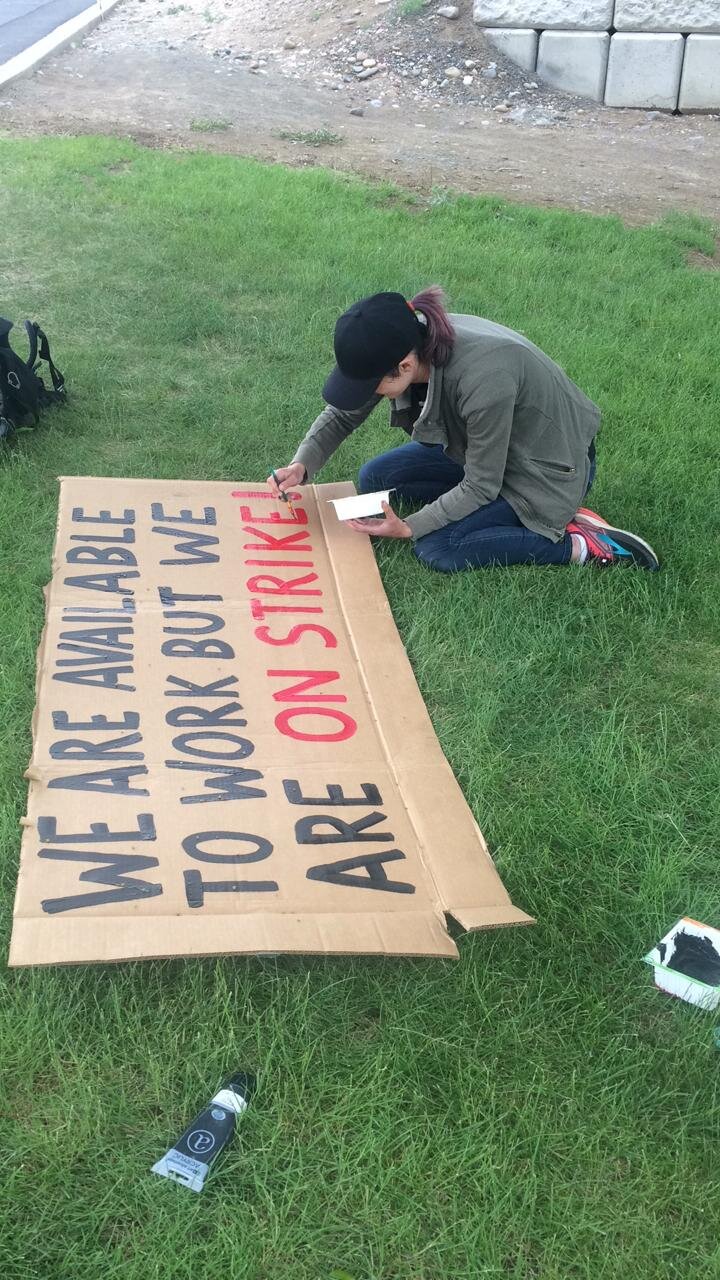  Abby painting signs at Jack Frost with messages requested by workers.   Photo by Maureen Darras  