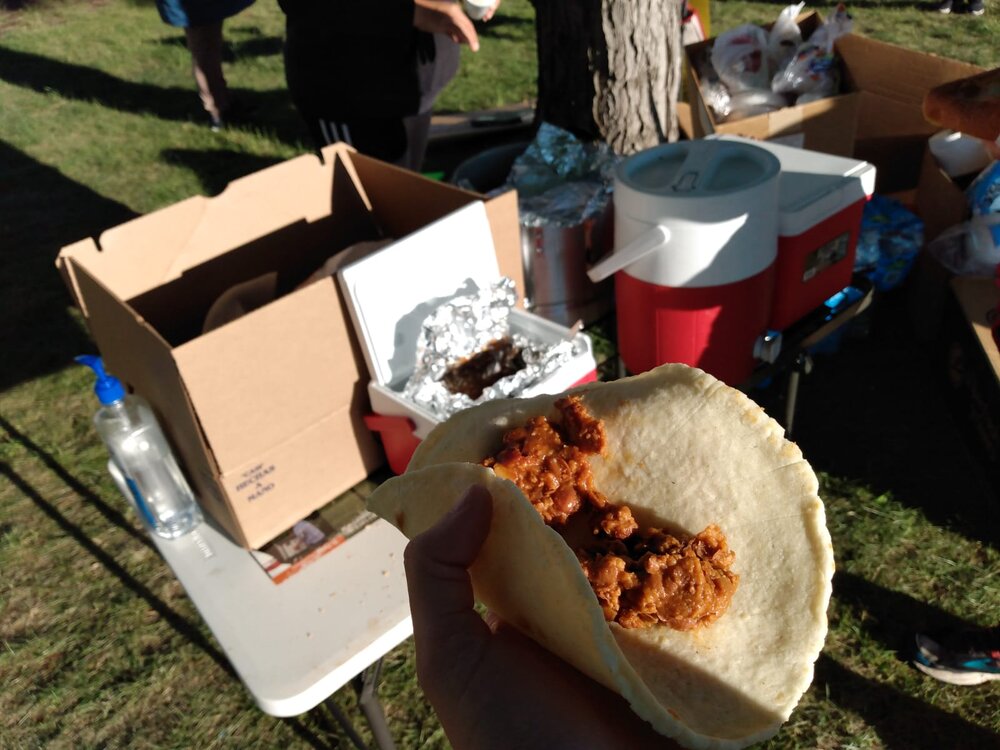  Tacos de frijoles con chorizo, made another day by women workers at Jack Frost. The food was so good, and prepared with so much love and care for those on the picket line. Behind the taco is a typical breakfast set up: champurrado in the beverage co