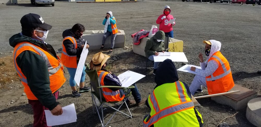  Workers filling out LNI complaint forms at Columbia Reach, around the corner from Jack Frost.   Photo by Abby Ernest-Beck  