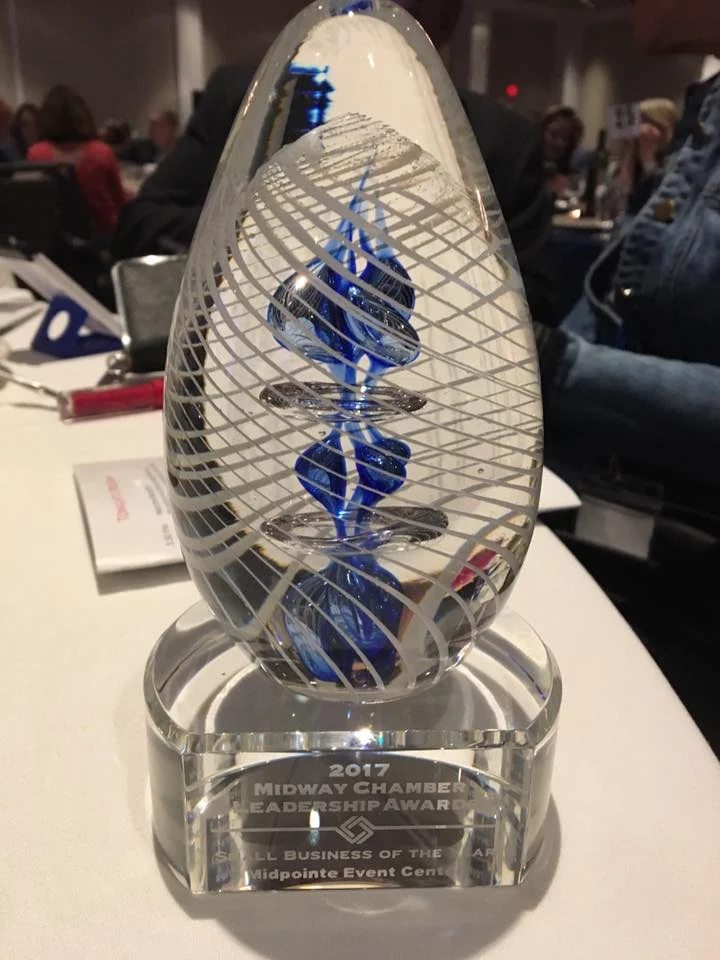 Midpointe Event Center receives the small business of the year award from the MIdway Chamber Of Commerce.