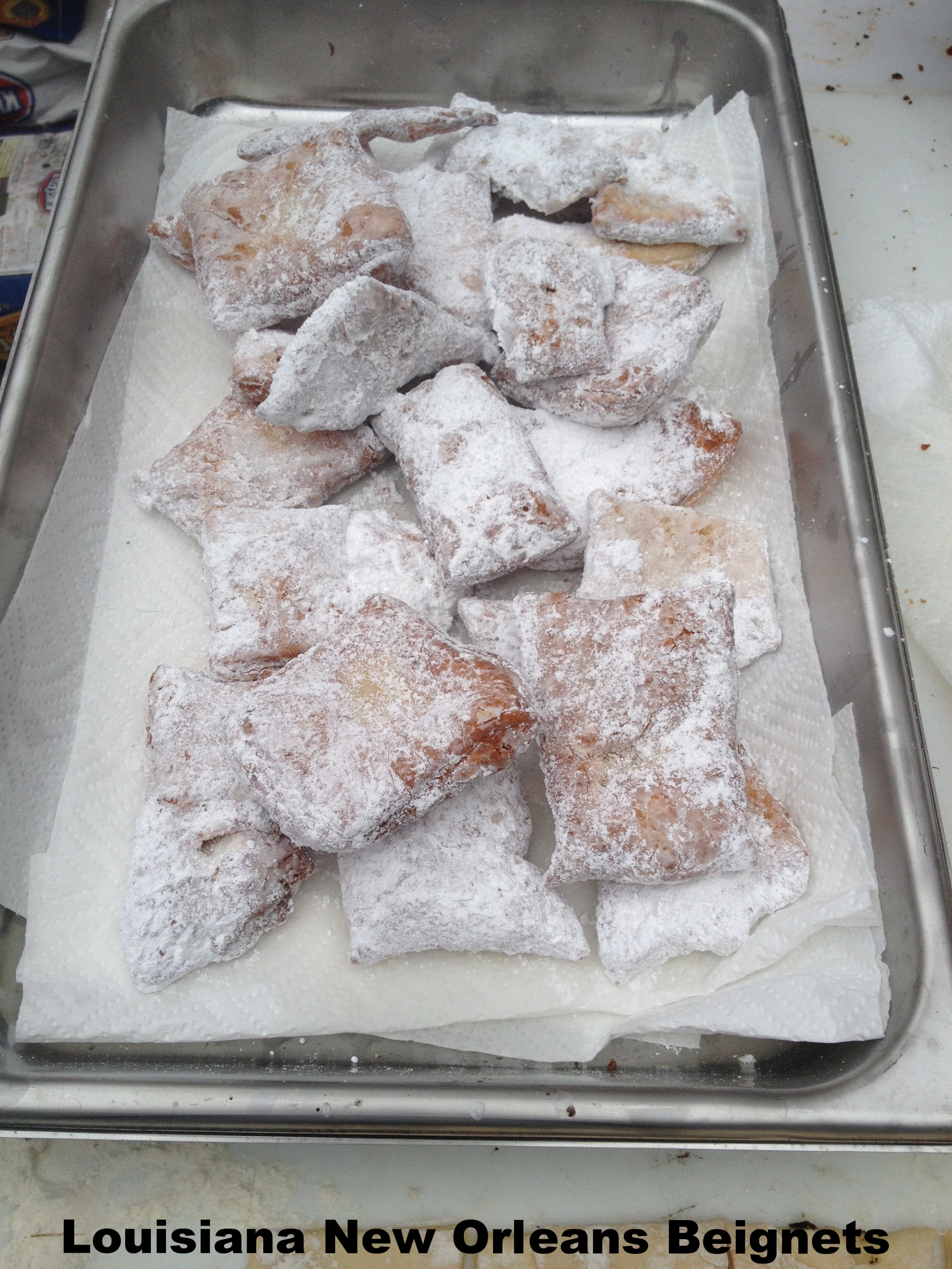 Beignets topped with powdered sugar.