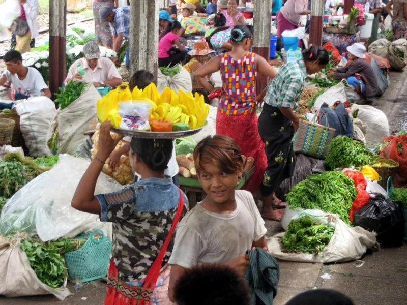 Busy market vendors at one stop on the circular train