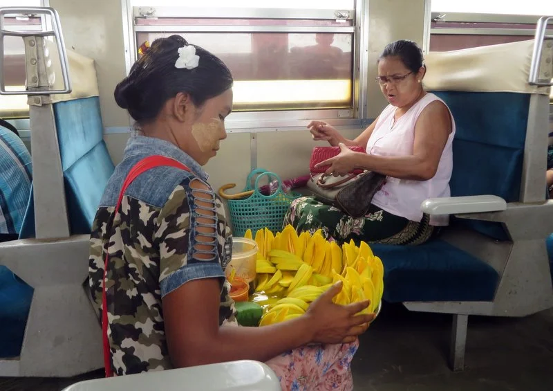 Mango vendors roam up and down the carriages selling their produce