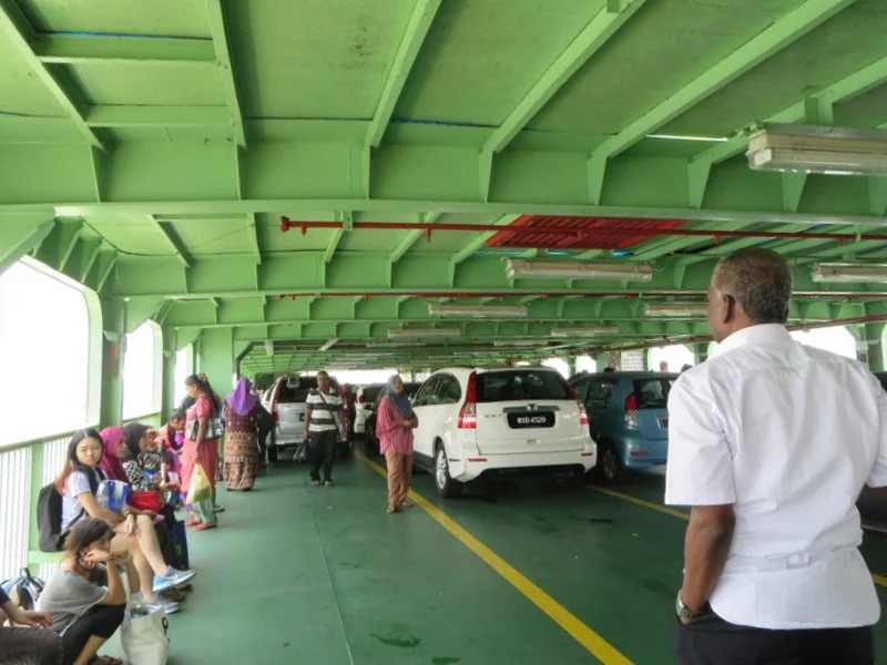 Standing room only on the open car deck during the short ferry crossing.