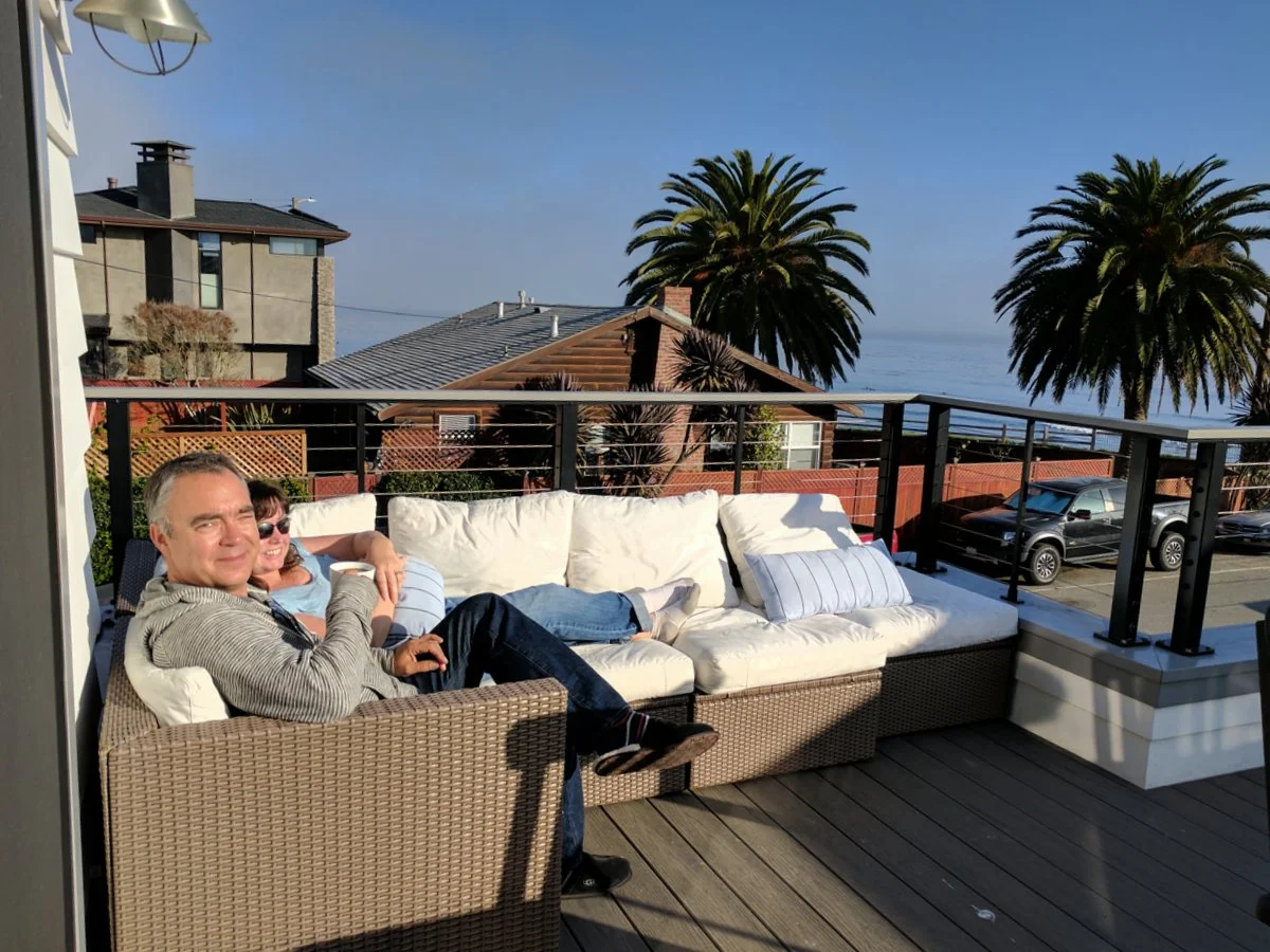It's a tough life. Iain and Shannon relaxing while watching whales on the horizon.