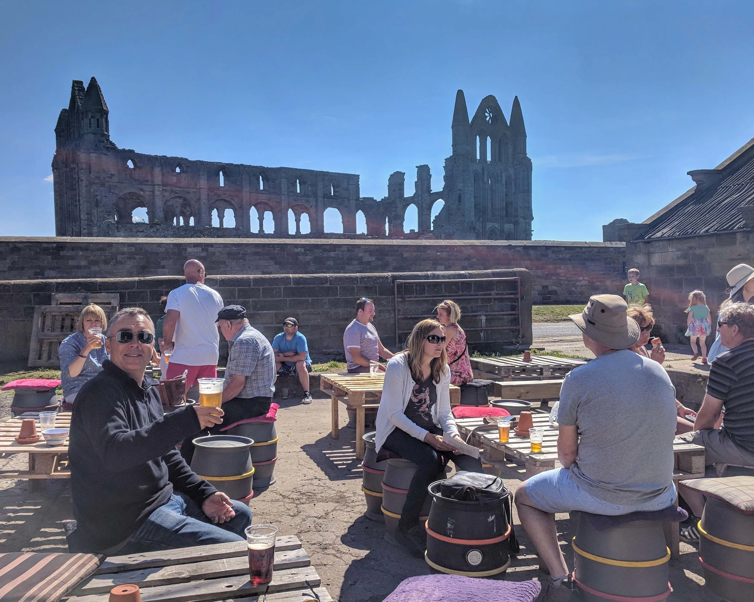 Drinking local beer at a brewery in the shadow of the abbey. 