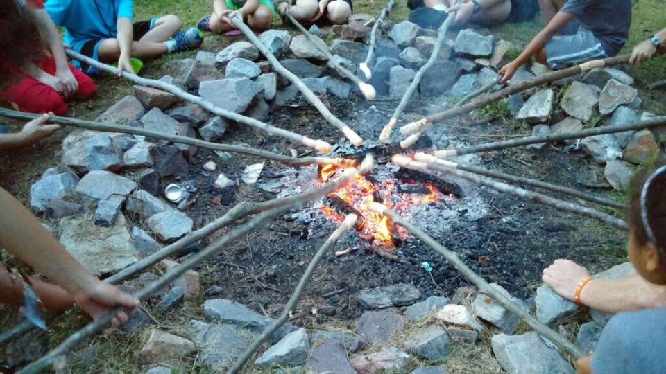 Cooking over the campfire.