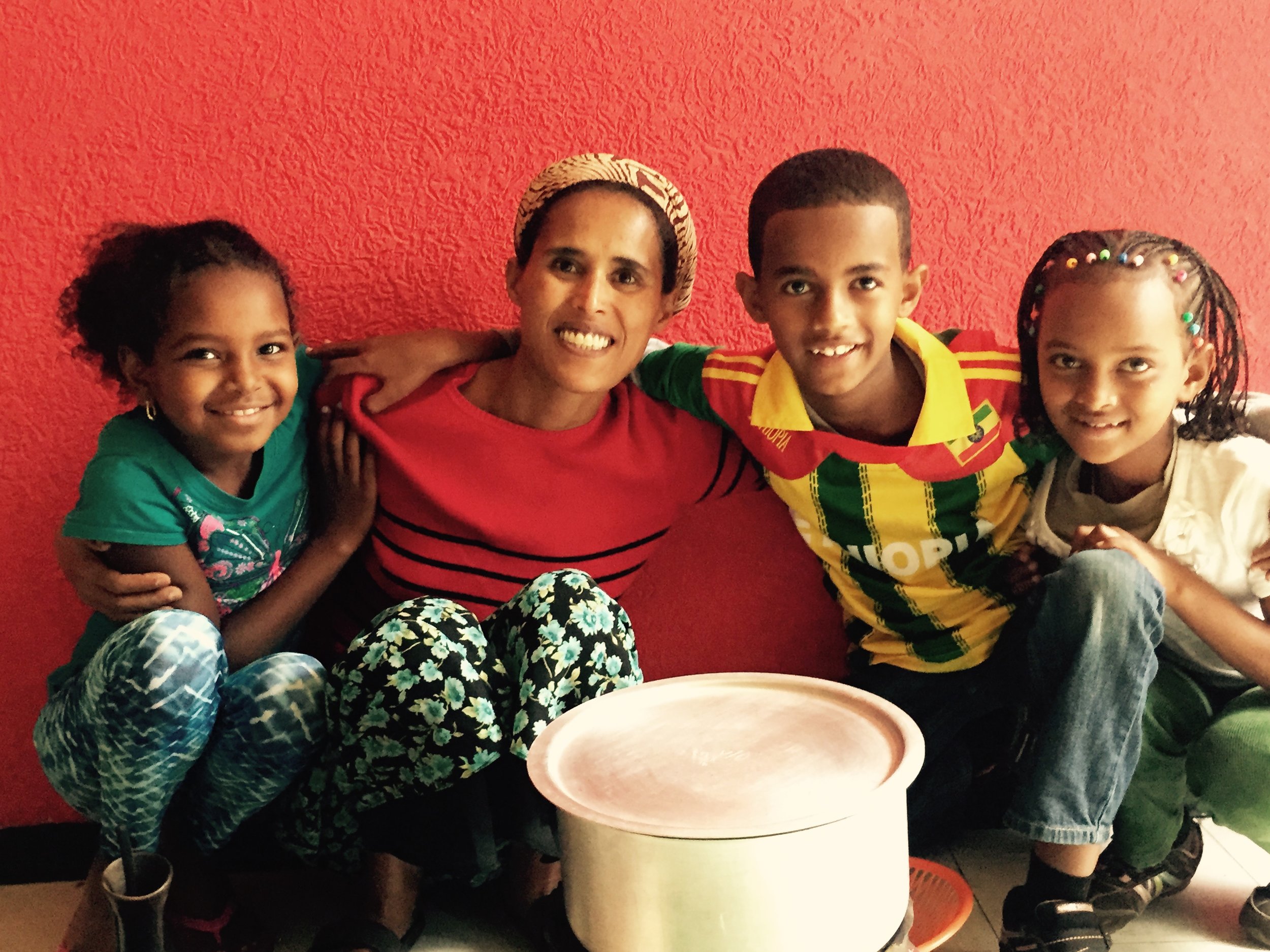 Carolyn Usher, a longtime sponsor of the group home, took this photo of her daughter Lilly, group home mom Mulu, her sponsored child Yabi, and Lilly's sister Mekdi (left to right).