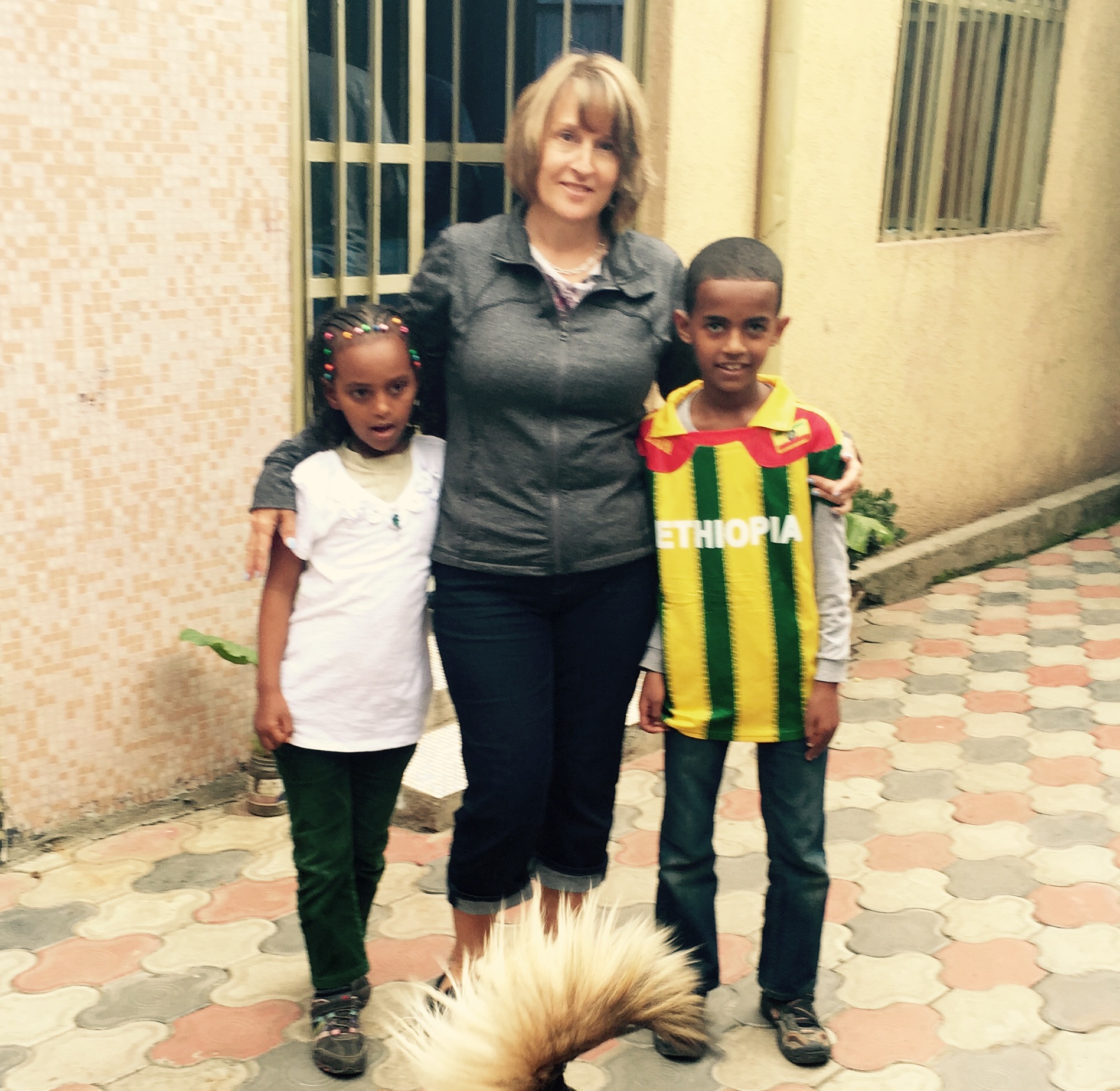 Longtime sponsor Carolyn Usher with her sponsored child, Yabi (right), and Mekdi, sister of Carolyn's daughter Lilly.