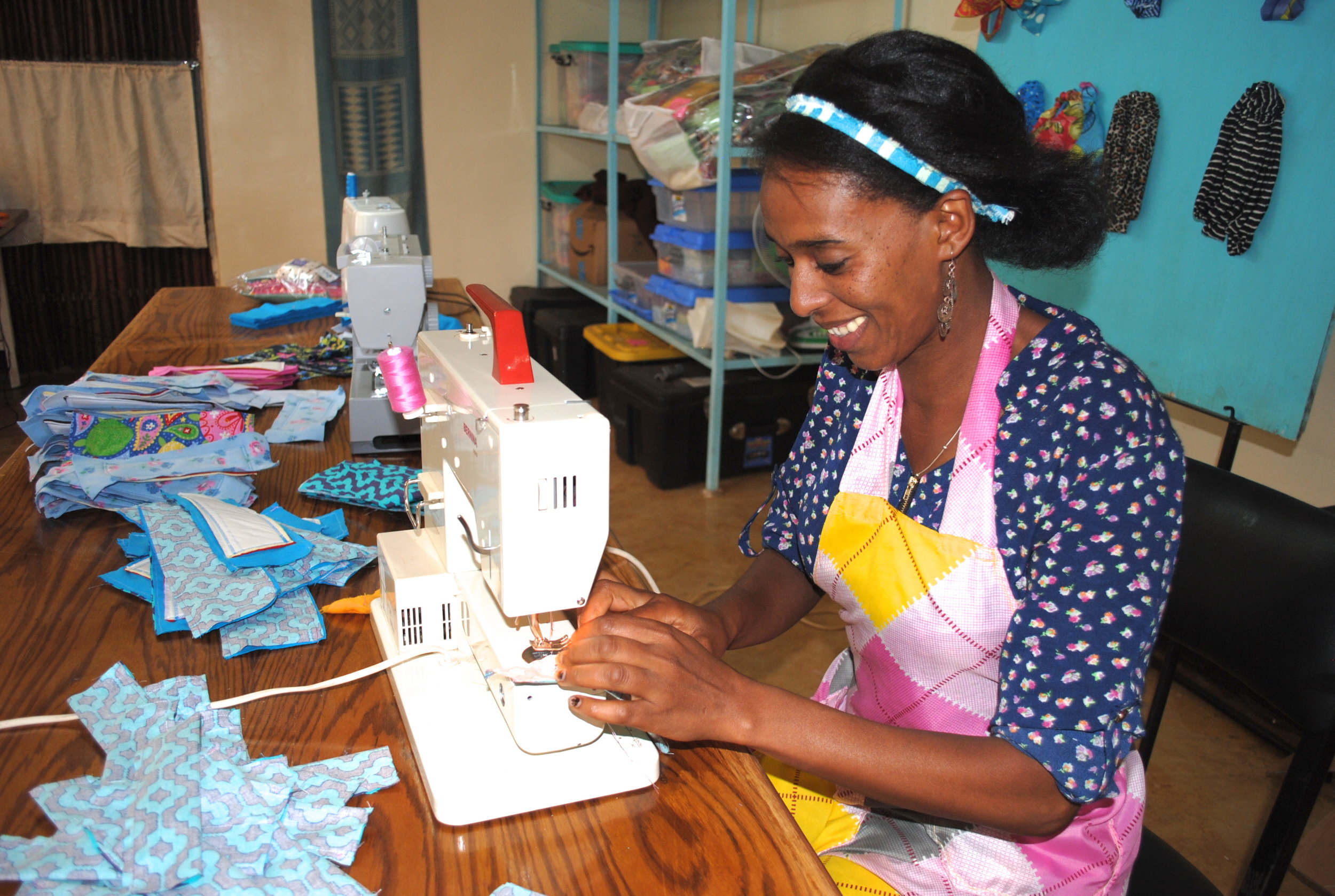 Serkalem sews a washable, reusable, affordable pad at the WRAPS facility in Wolaitta Village. She's one of six women employed by the project, which helps to keep girls in school by providing them with safe and sanitary pads to use when they have their menstrual periods.