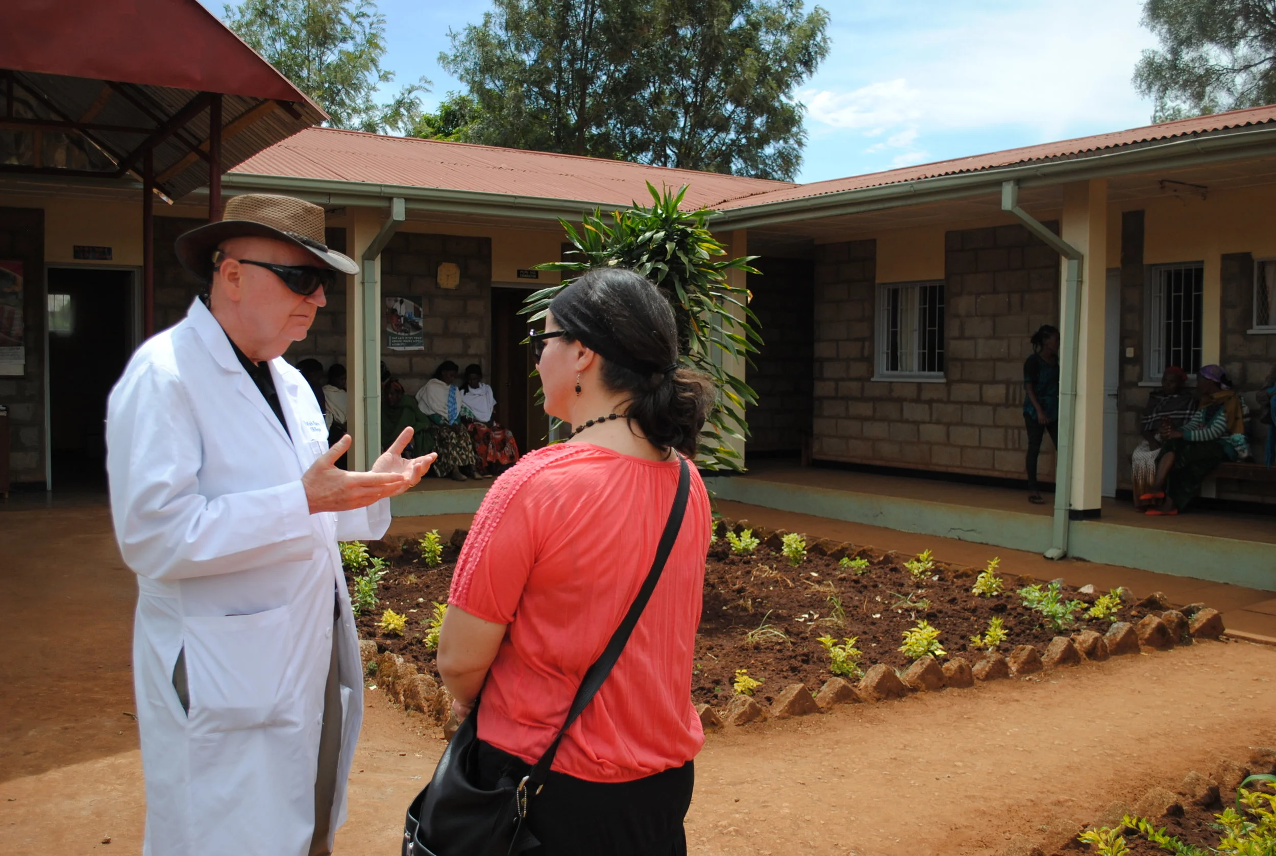 Dr. Mark chats with Shelley outside the Bucama Health Clinic in rural Ethiopia in February 2017. This facility directs some patients to Soddo Christian Hospital to undergo surgery with Dr. Mark.