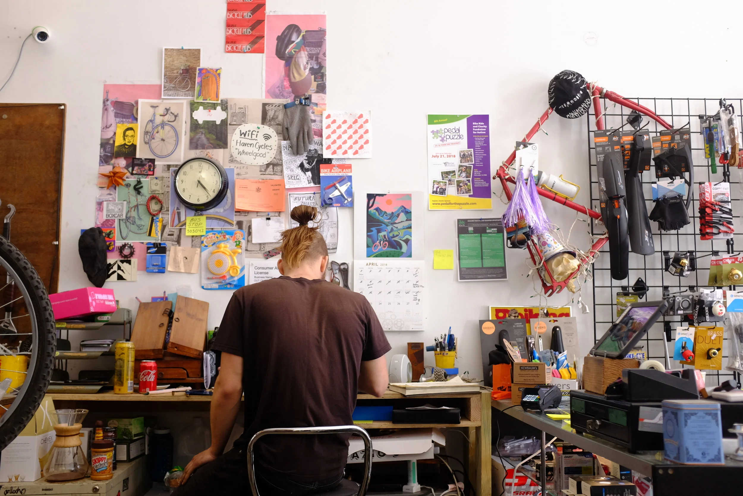  Mike completing service writing at the desk 