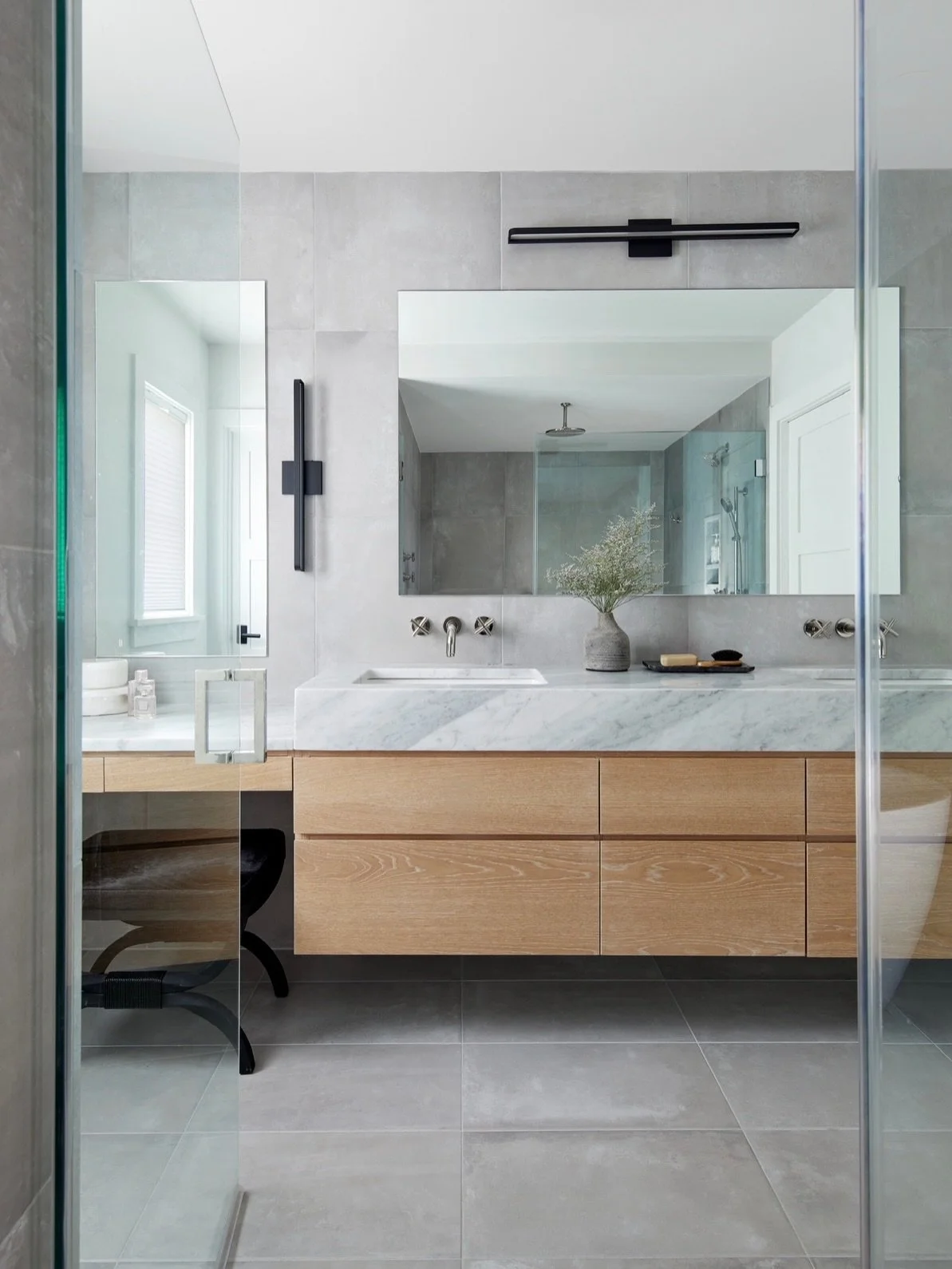 Spa. Day. Every. Day. 🛁 This primary bath was part of a whole home renovation, and it is giving eeeeeverything - soaking tub, rain shower, floating marble counters, and a vanity nook that actually makes getting ready feel luxurious. This is what a w