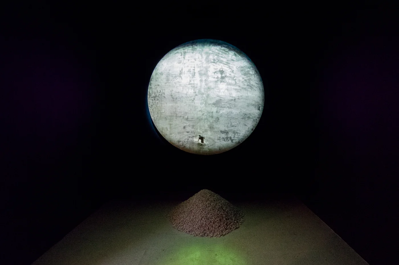 FORUM IV Video Projection, Gold Paint on Drywall Joint Compound, White Marl Stone. Dimensions Variable. Two Channel Audio. Duration: 2:40