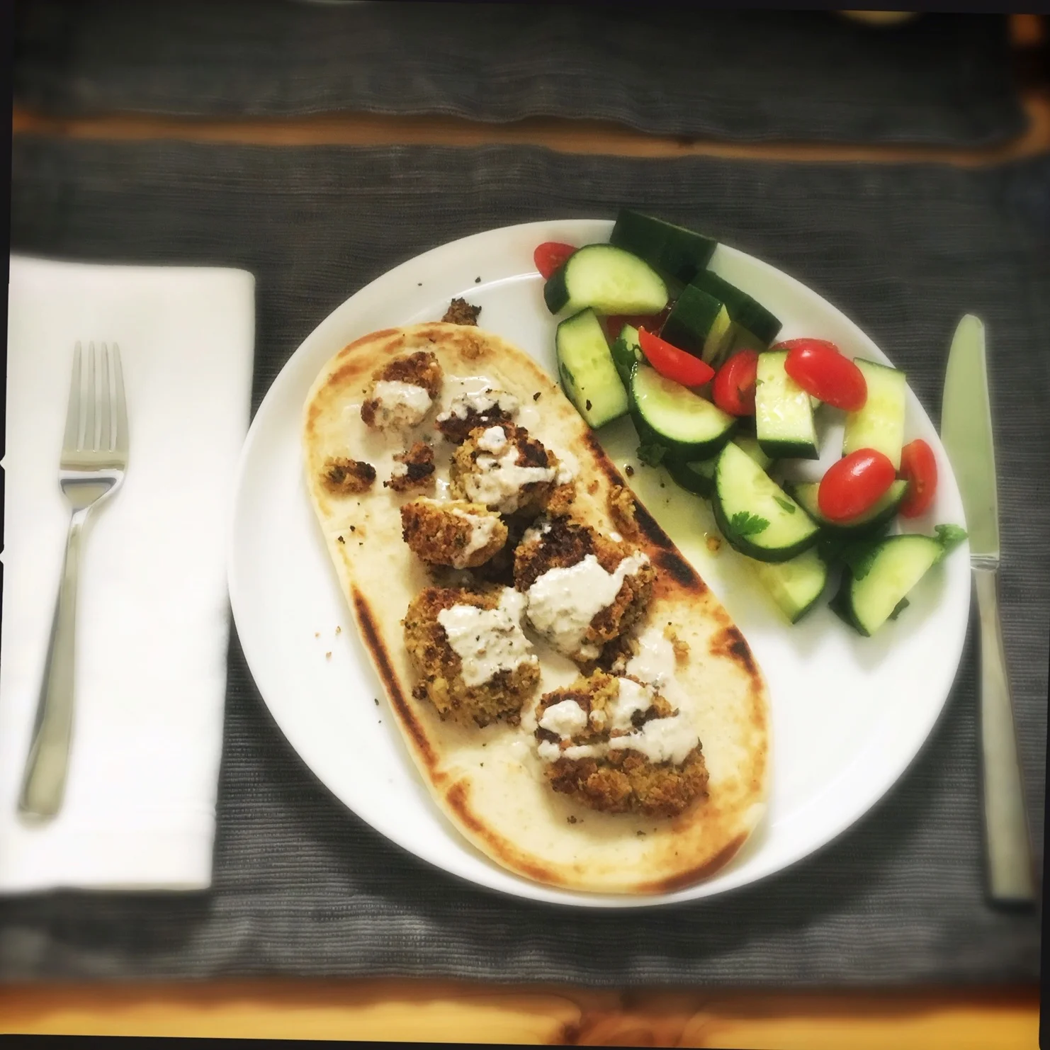 Crispy falafel with Israeli salad and naan.