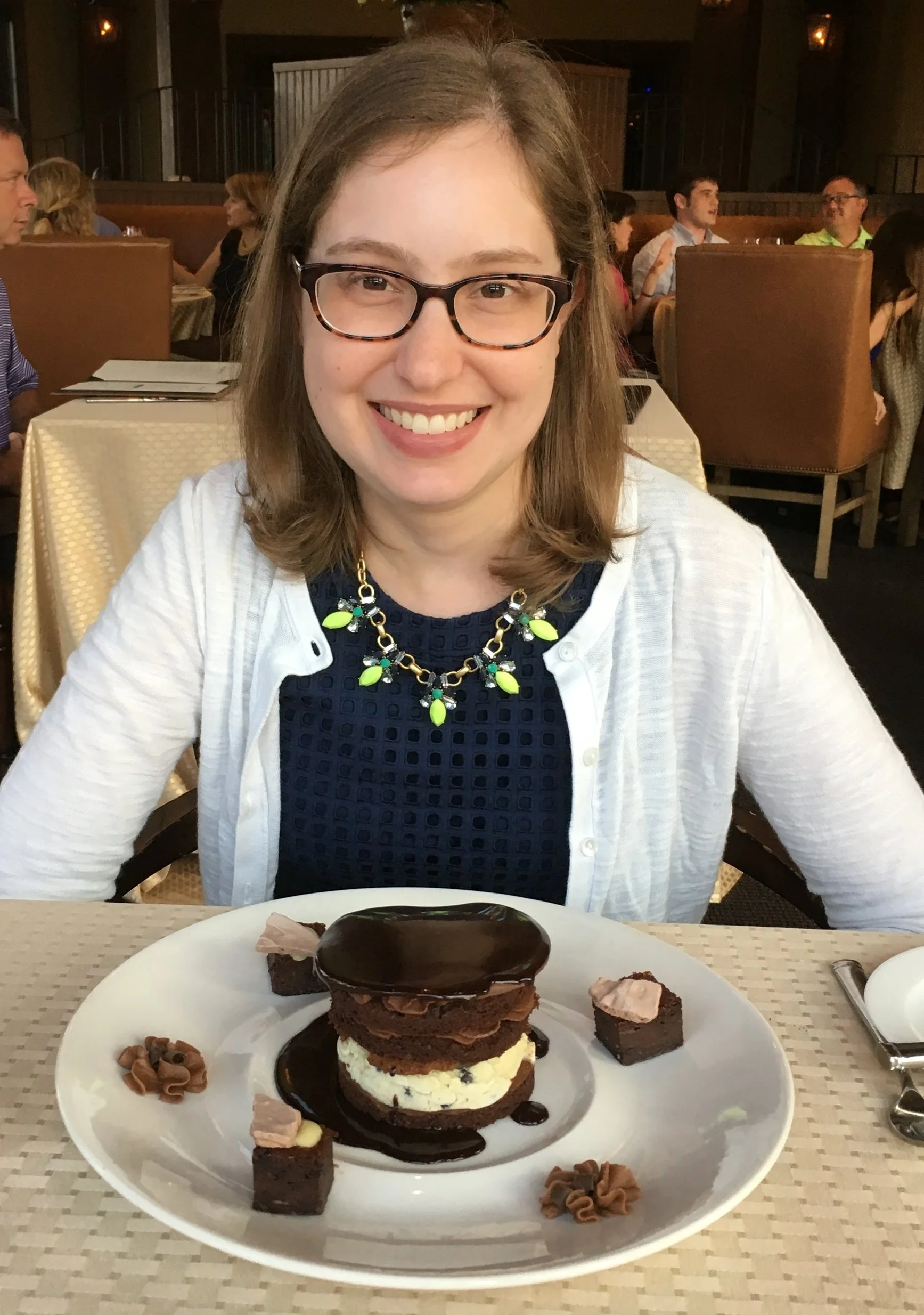 Me back in 2016 with moon face from Prednisone. That is a mint chocolate chip ice cream cake, and yes, I did eat almost the whole thing by myself.