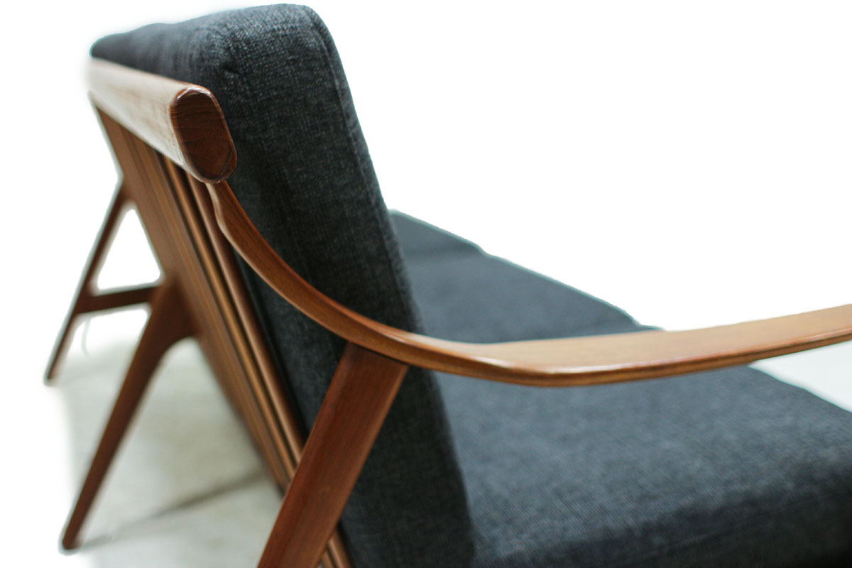 1960's Danish Designer MCM Teakwood Sofa with Sculpted Armrests and Dark Grey Cushions Designed by Arne Hovmand Olsen