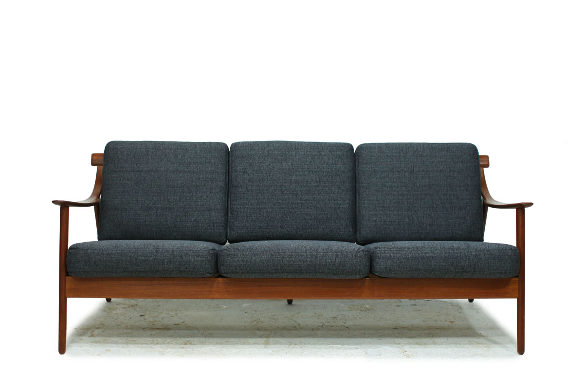 1960's Danish Designer MCM Teakwood Sofa with Sculpted Armrests and Dark Grey Cushions Designed by Arne Hovmand Olsen