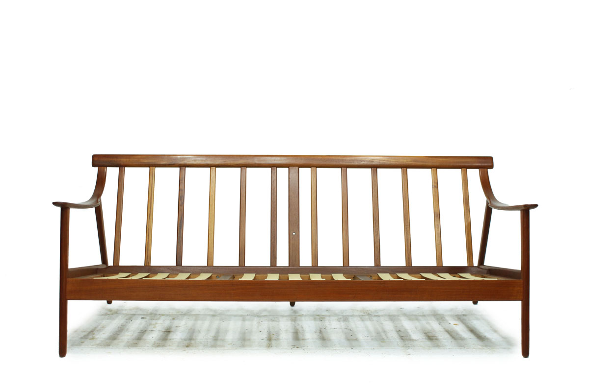 1960's Danish Designer MCM Teakwood Sofa with Sculpted Armrests and Dark Grey Cushions Designed by Arne Hovmand Olsen