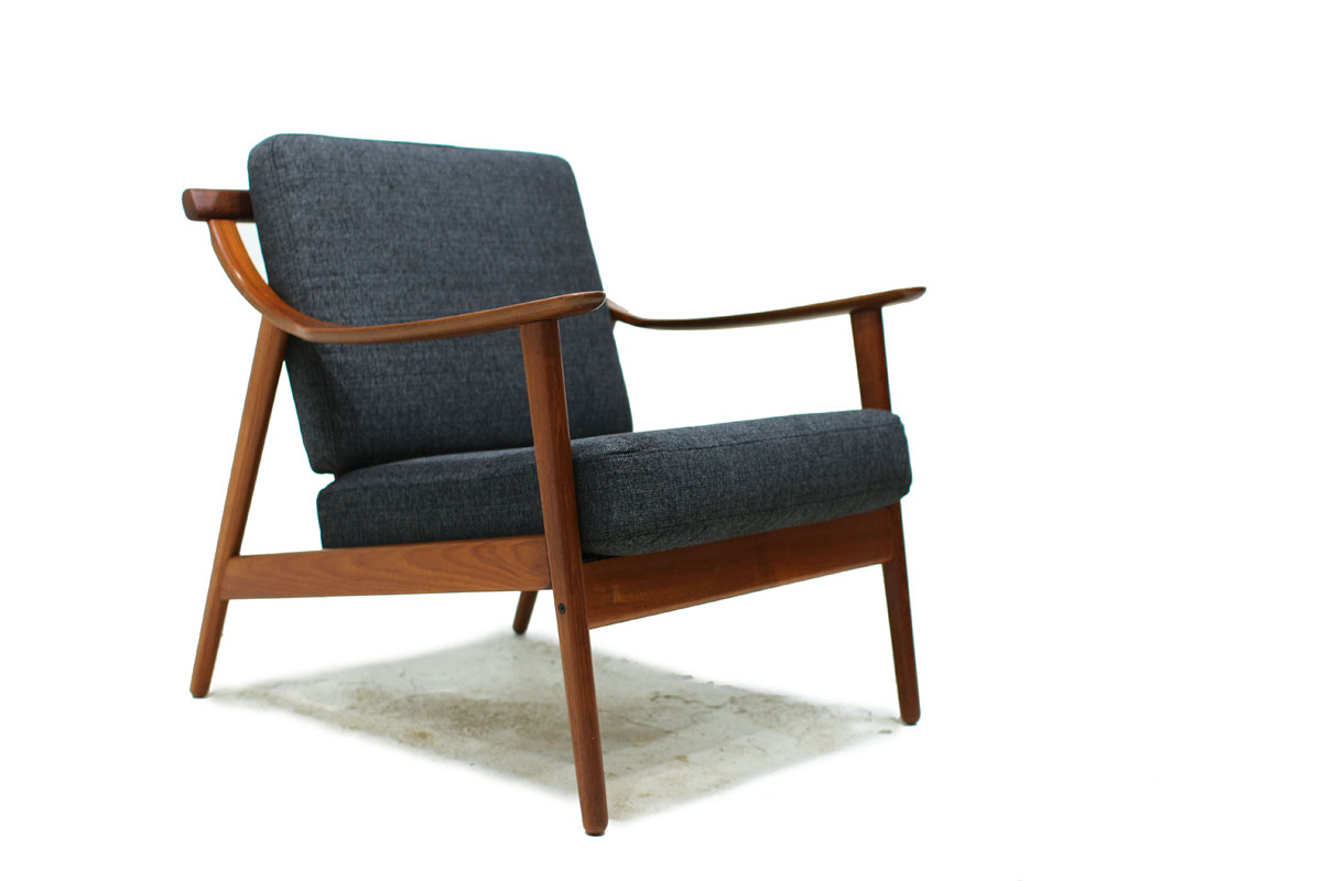 1960's Danish Designer Teak Wood Lounge Chair With Sculpted Armrests and Dark Gray Cushions Designed by Arne Hovmand Olsen