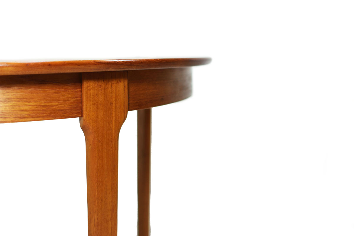 Mid Century Modern Round Extendable to Oval Teakwood Table with 2 leafs and notched leg system